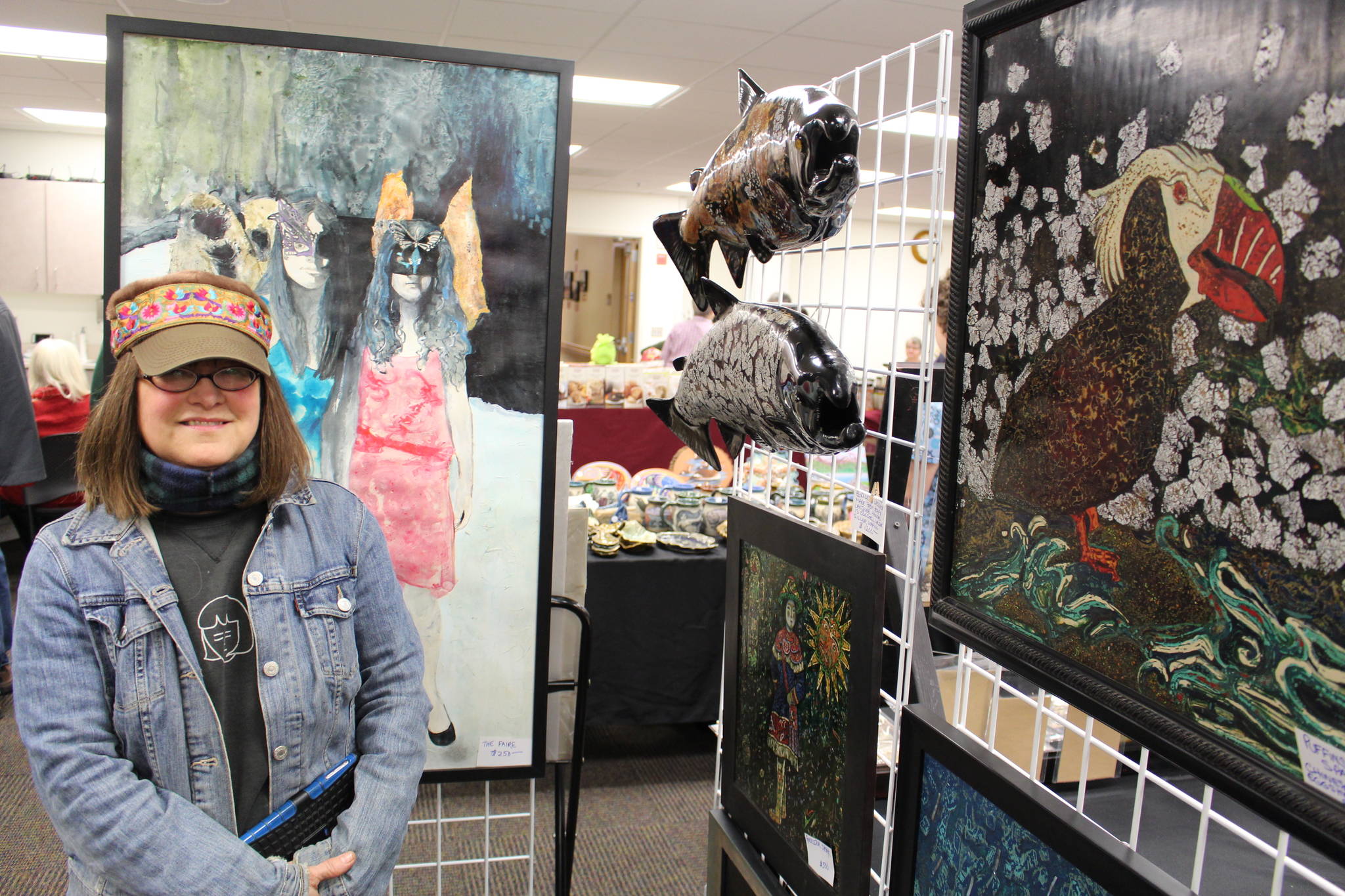 Artist Kathy Matta displays some of her art for sale at the annual Central Peninsula Hospital Auxiliary Holiday Bazaar in Soldotna, Alaska on Dec. 6, 2019. (Photo by Brian Mazurek/Peninsula Clarion)