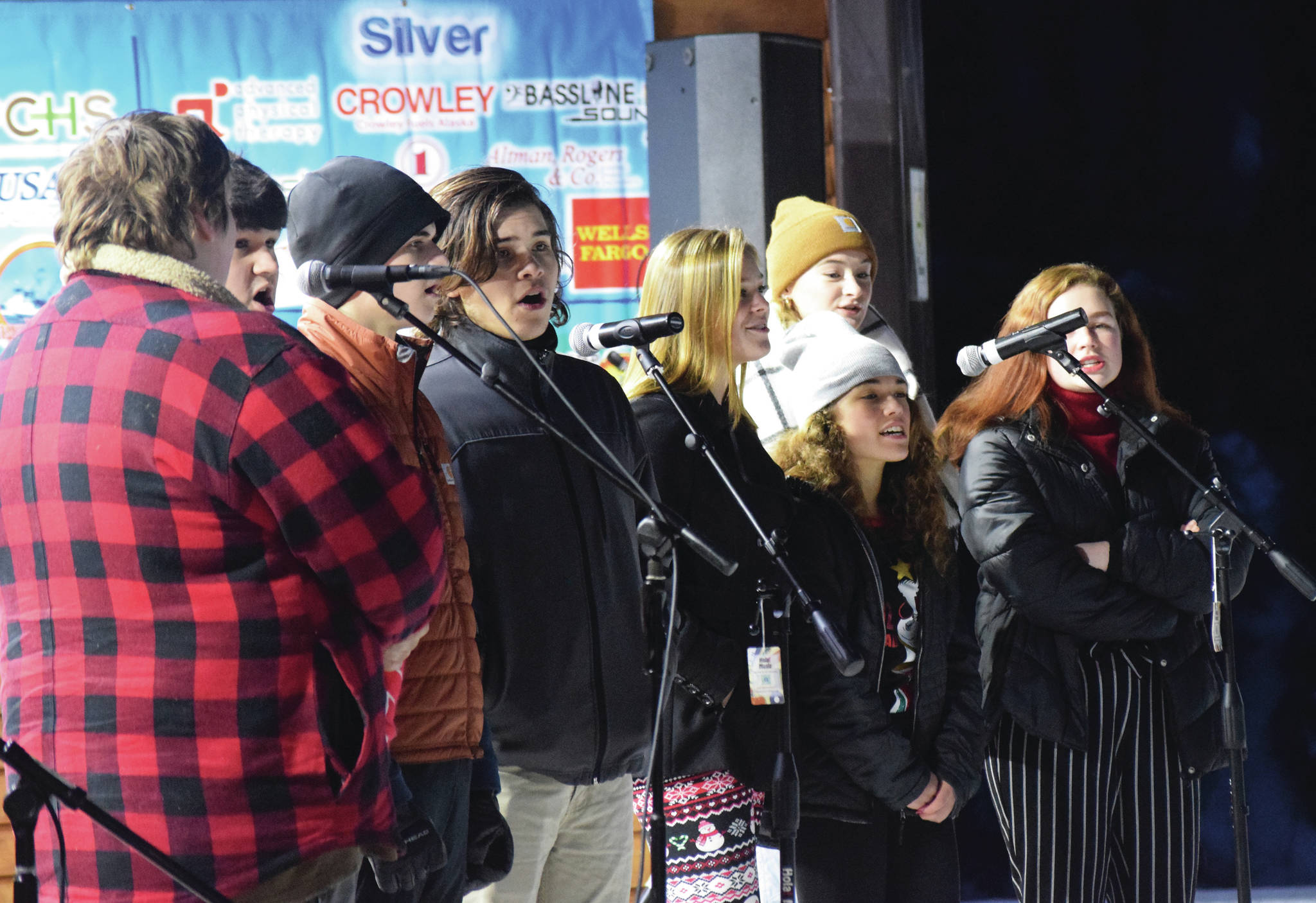 The Class Act Drama Troupe entertains the crowd with singing Saturday, Dec. 7, 2019, at the Christmas in the Park celebration at Soldotnat Creek Park in Soldotna, Alaska. (Photo by Joey Klecka/Peninsula Clarion)