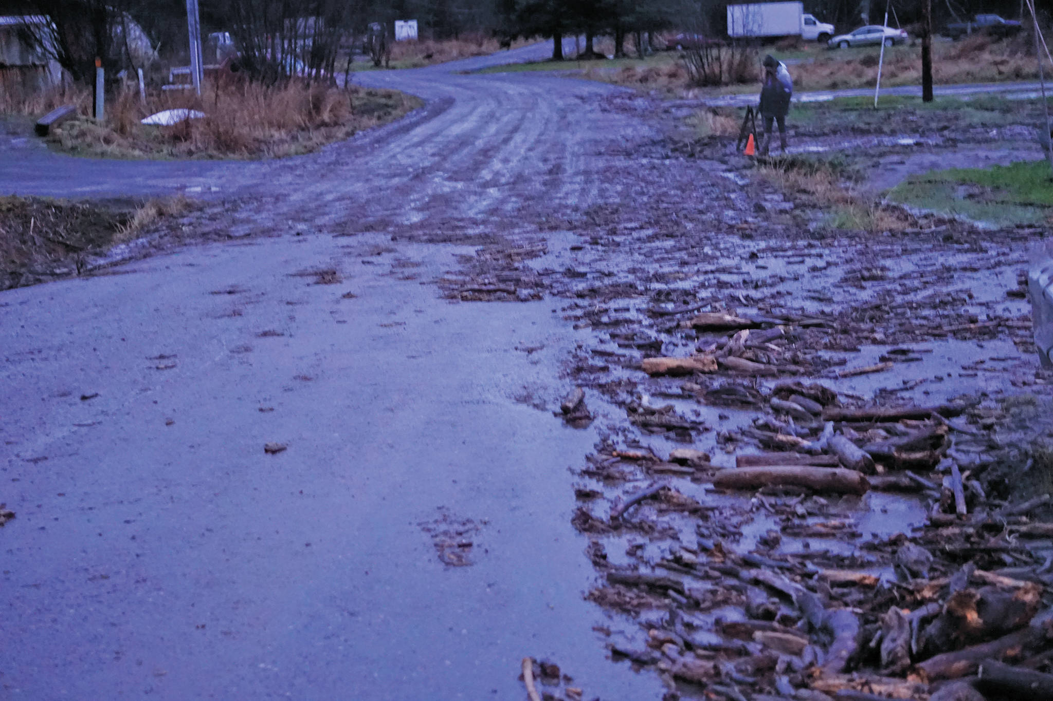 Debris from a flood fills ditches along Meadow Drive near East End Road on Monday afternoon, Dec. 9, 2019, in Homer, Alaska. Bear Creek crosses East End Road near Bear Creek Drive and overflowed the creek banks. (Photo by Michael Armstrong/Homer News)