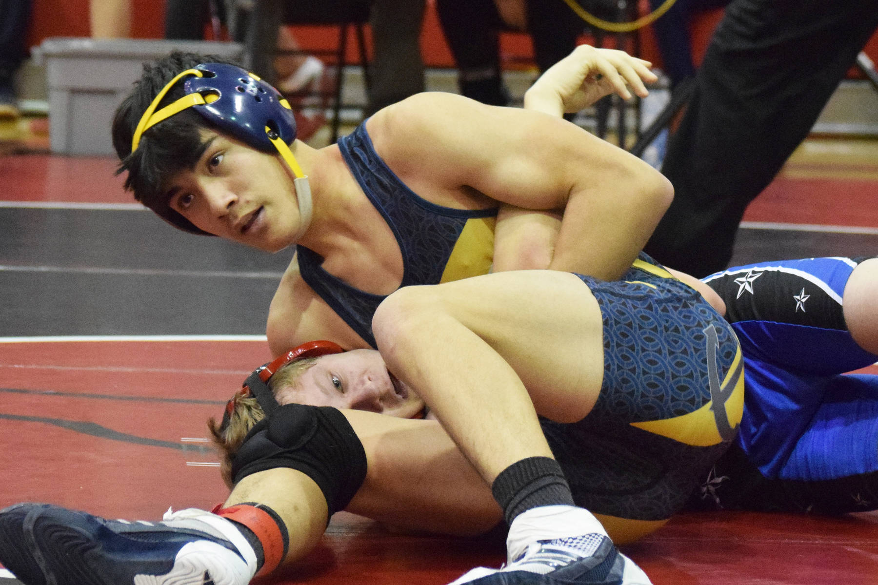 Homer’s Russell Nyvall grabs Soldotna’s Peyton Lawton in a headlock Saturday, Oct 26, 2019, at the Luke Spruill Memorial Tournament at Kenai Central High School in Kenai, Alaska. (Photo by Joey Klecka/Peninsula Clarion)