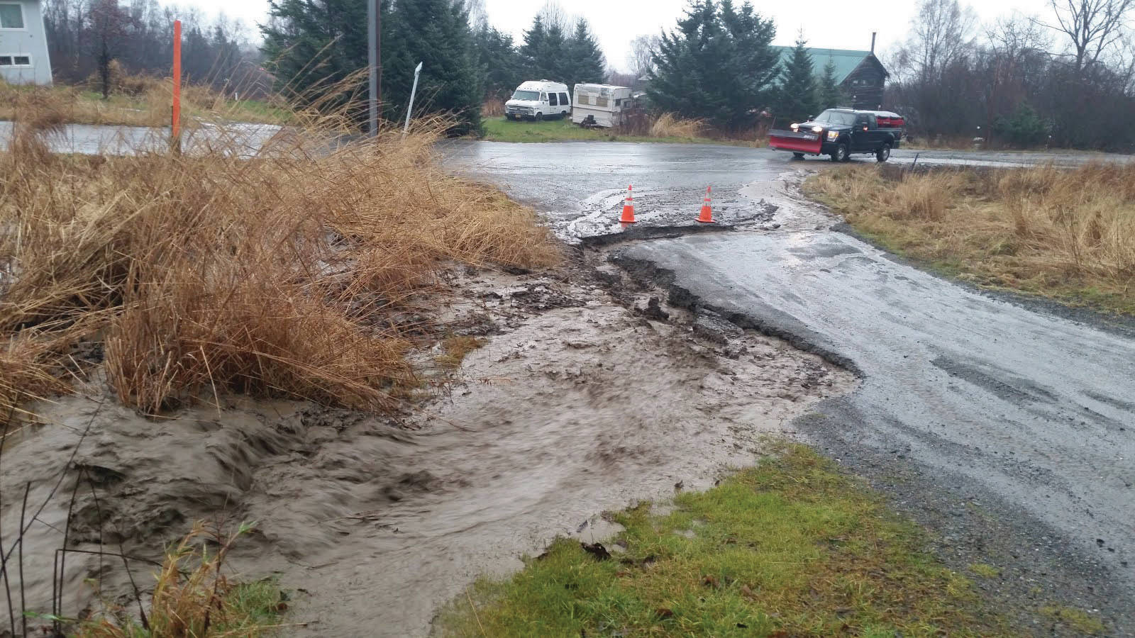 A partially washed out road can be seen on Newman Court in Diamond Ridge. (Photo courtesy of Kenai Peninsula Borough Office of Emergency Management)