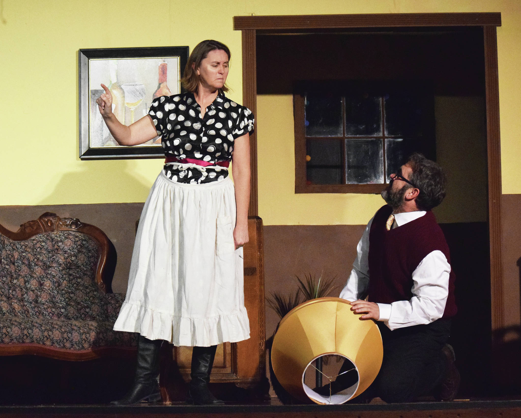 Carla (left) and Chris Jenness act out a scene Tuesday, Dec. 17, 2019, at a rehearsal of “A Christmas Story” by the Triumvirate Theatre North in Kenai, Alaska. (Photo by Joey Klecka/Peninsula Clarion)