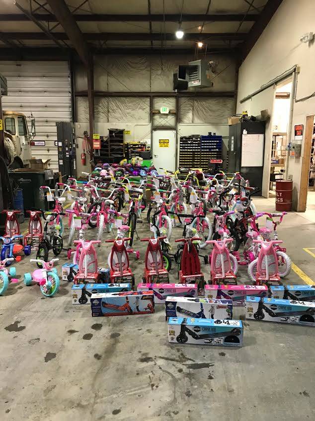 Alaska Waste team donates more than 60 bikes to give to area children this holiday season. (Photo by Alaska Waste Kenai District Manager Andy Ivey/provided by Alaska Waste)