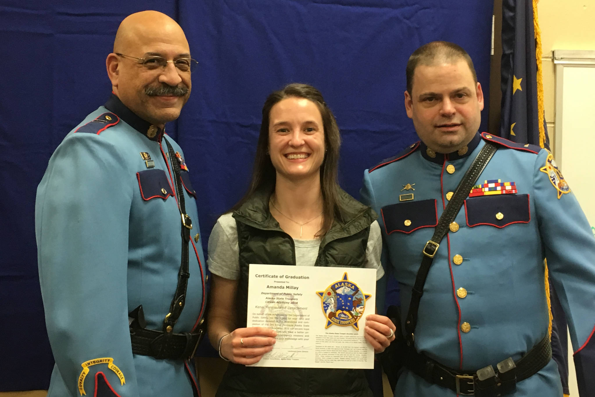 Capt. Maurice Hughes (left) Amanda Millay and retired Lt. Dane Gilmore celebrate Millays completion of the Alaska State Trooper Citizen Academy in this undated photo. (Courtesy Lt. Michael Zweifel/Alaska State Troopers)
