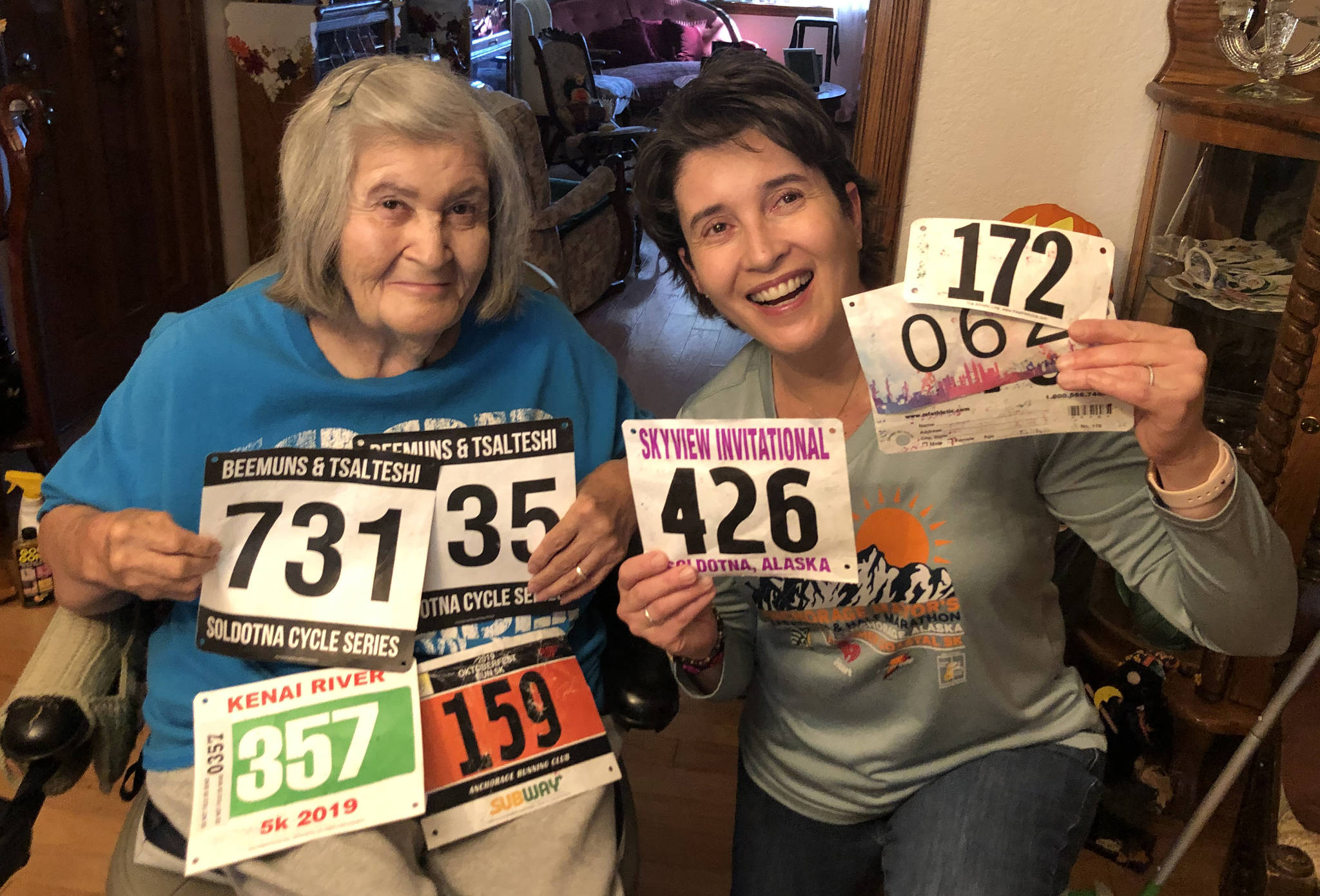 Salli Sterrett receives race bibs from her daughter, Sheilah-Margaret Pothast, in Arizona in late October. Pothast is doing 50 races in her 50th year for her mother. (Photo provided by Sheilah-Margaret Pothast)