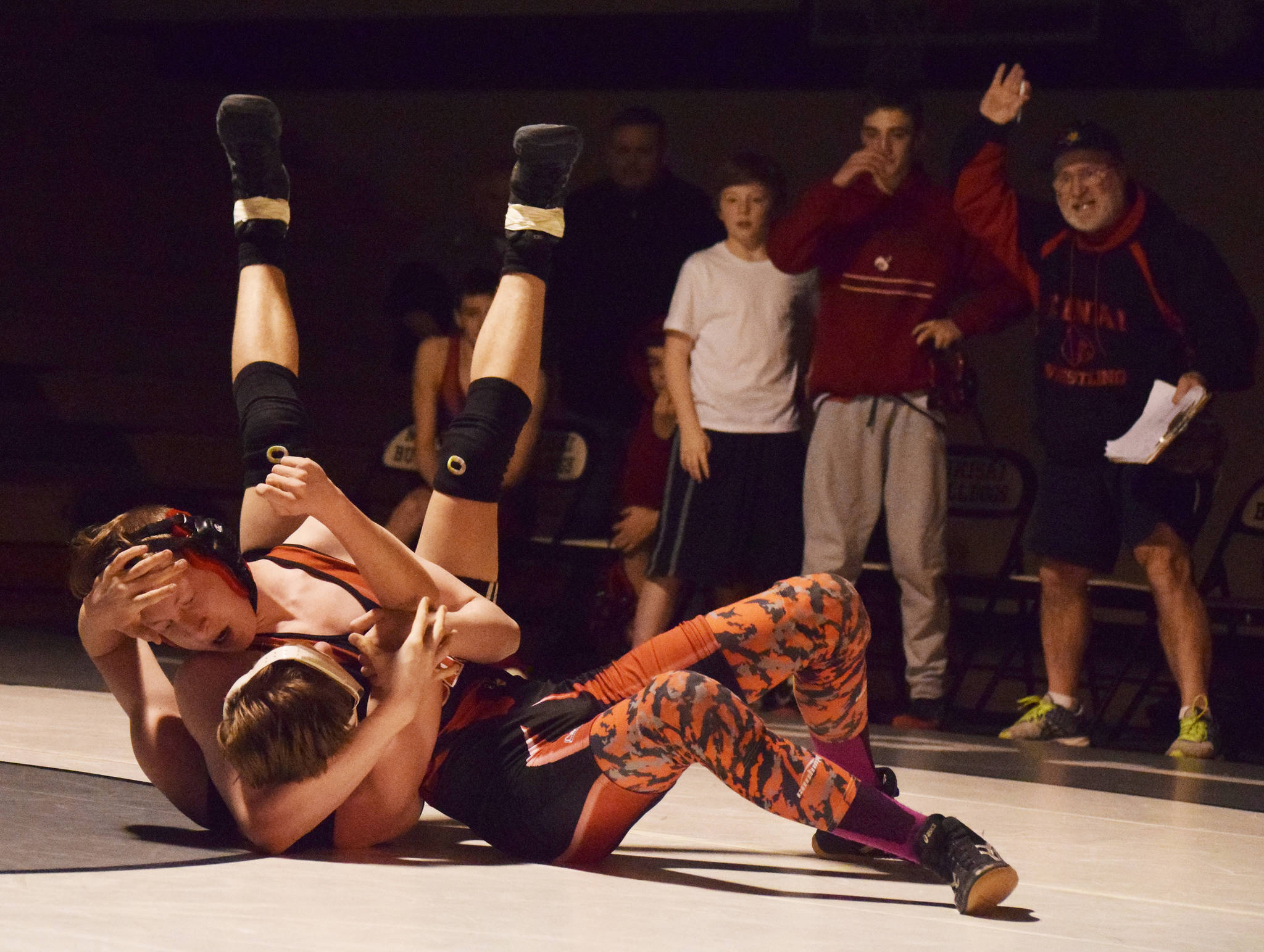 Nikiski’s Yorik Bastuck grapples with Kenai’s Isaiah Ticknor, Tuesday, Nov. 19, 2019, at a Kenai/Nikiski dual meet at Nikiski High School. (Photo by Joey Klecka/Peninsula Clarion)