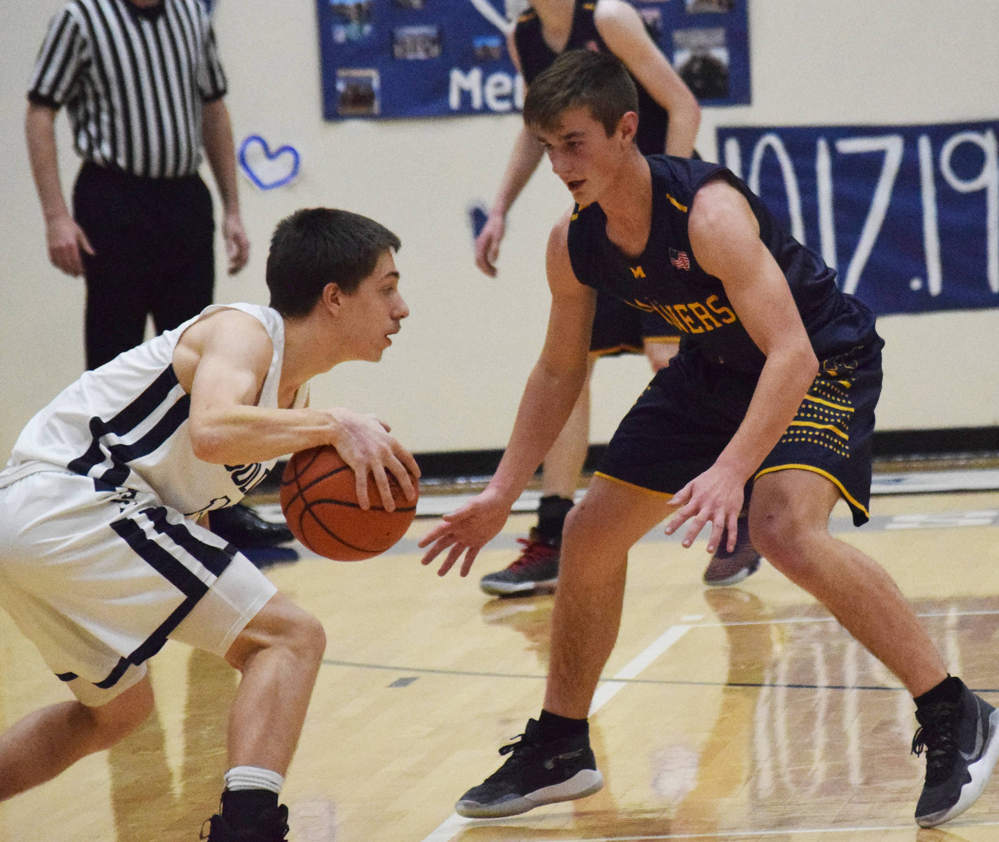 Homer’s Clayton Beachy (right) keeps close watch on Soldotna’s Jersey Truesdell, Friday, Dec. 20, 2019, at the Powerade/Al Howard Tip-Off tournament at Soldotna High School. (Photo by Joey Klecka/Peninsula Clarion)