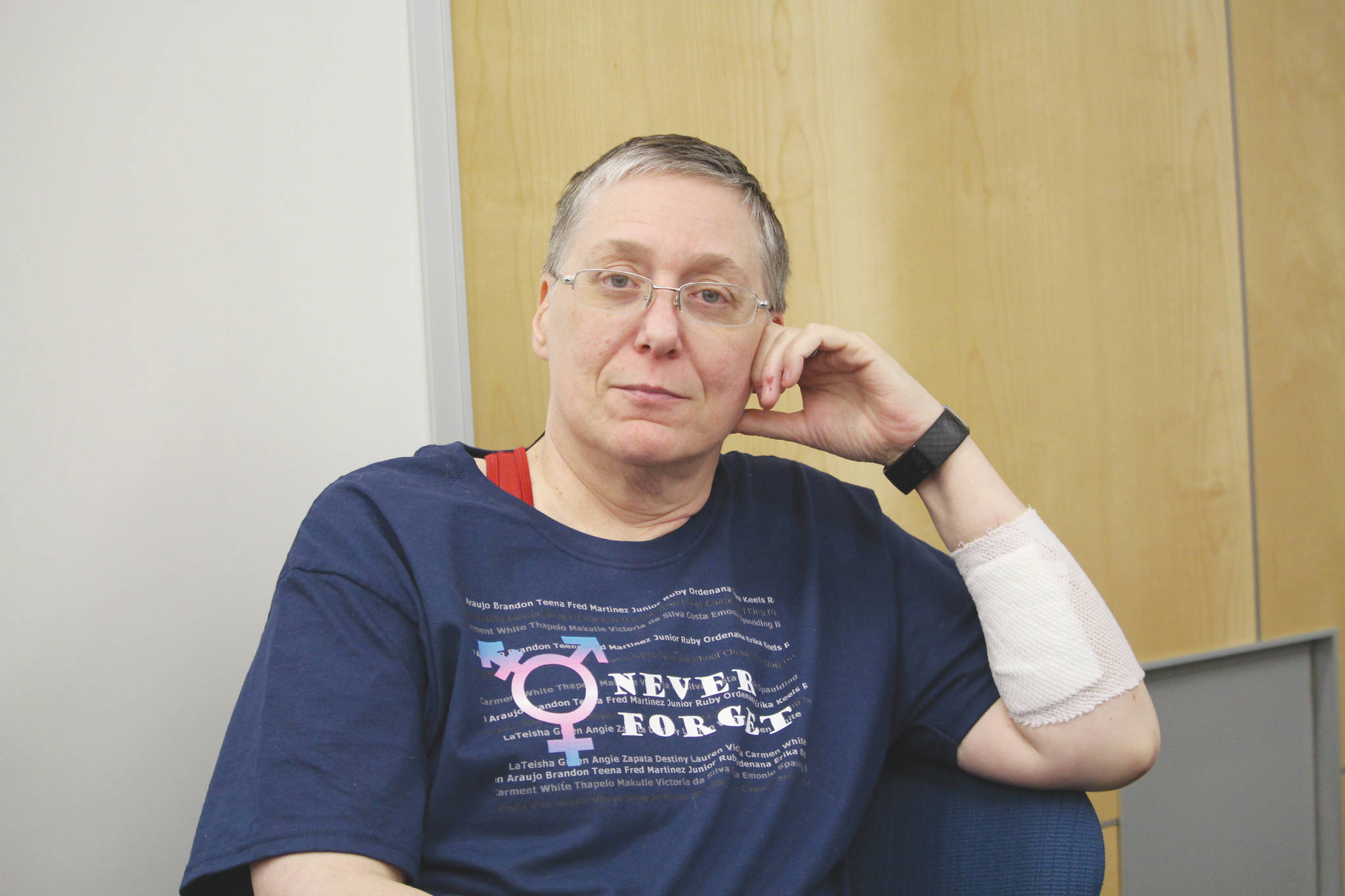 Brian Mazurek / Peninsula Clarion                                Tammie Willis is seen here at Kenai Peninsula College on Dec. 19. The bandage on her arm covers some of the cuts Willis received while being attacked at her home Dec. 9.