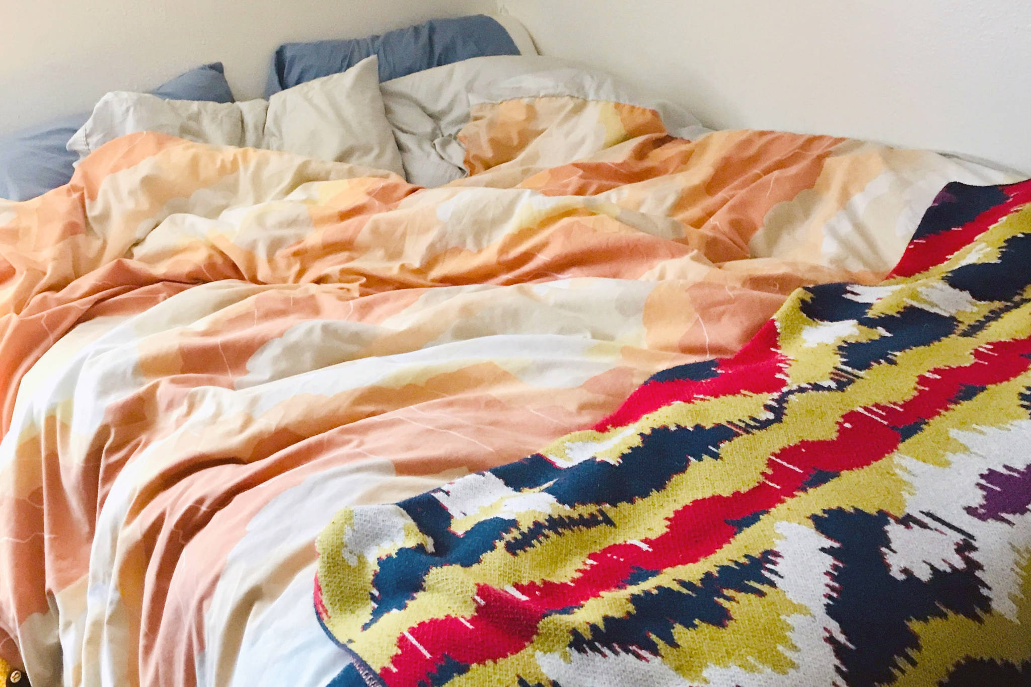 Two blankets gifted at each end of this decade grace the author’s bed. (Photo by Kat Sorensen)