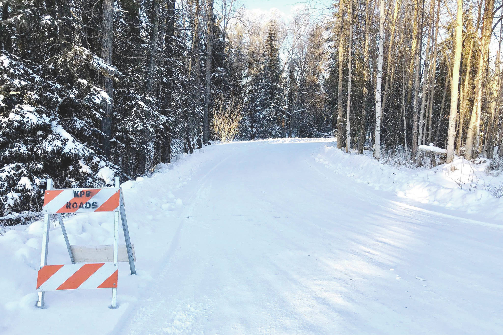 Victoria Petersen / Peninsula Clarion                                 A Kenai Peninsula Borough barricade sits near Eddy Lane off of Big Eddy Road near Soldotna on Tuesday to keep traffic from traveling over flooded areas.