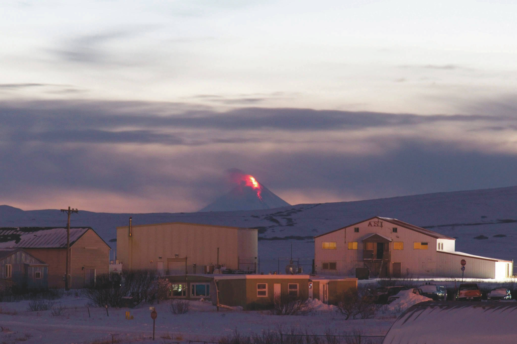 This Monday, Jan. 6, 2020, photo provided by Aaron Merculief shows lava flowing from a vent on the Shishaldin Volcano, as seen from Cold Bay, Alaska about 58 miles North East of Shishaldin. The volcano, in Alaska‚Äôs Aleutian Island erupted at 5 a.m. Tuesday. A few hours later, another eruption pushed an ash cloud to 25,000 feet, and the National Weather Service issued a warning for passing aircraft. (Aaron Merculief via AP)