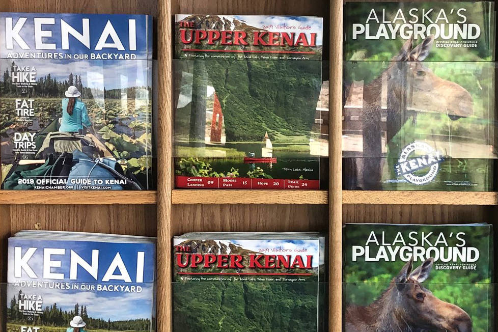 Visitor guides await travelers at the Kenai Municipal Airport, Thursday, June 20, 2019, in Kenai, Alaska. (Photo by Victoria Petersen/Peninsula Clarion)