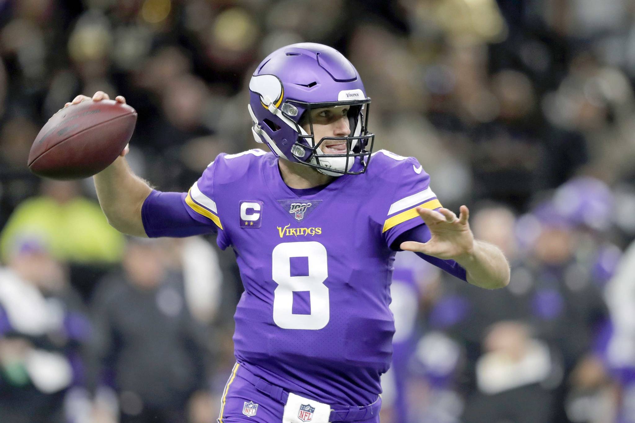 Minnesota Vikings quarterback Kirk Cousins (8) drops back to pass as he throws a pass that was fumbled and recovered by the New Orleans Saints in the first half of an NFL wild-card playoff football game, Sunday, Jan. 5, 2020, in New Orleans. (AP Photo/Gerald Herbert)