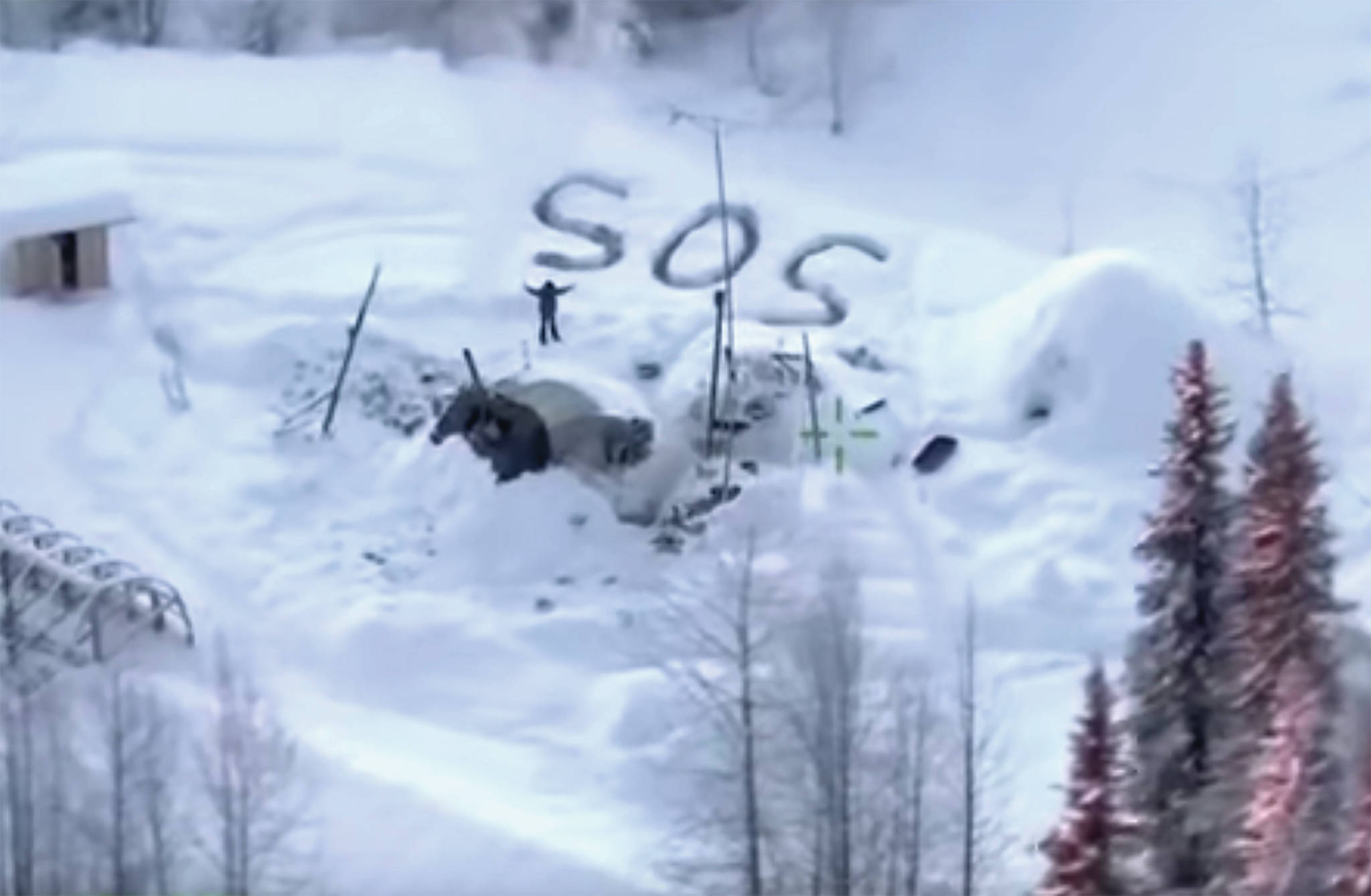 Alaska State Troopers                                In this image made from video released by the Alaska State Troopers, an aerial helicopter view from Jan. 9, shows a man waving with distress signal “S.O.S.” outside Susitna Valley. Alaska State Troopers have rescued Tyson Steele, 30, who survived in a makeshift shelter after his remote cabin burned last month.