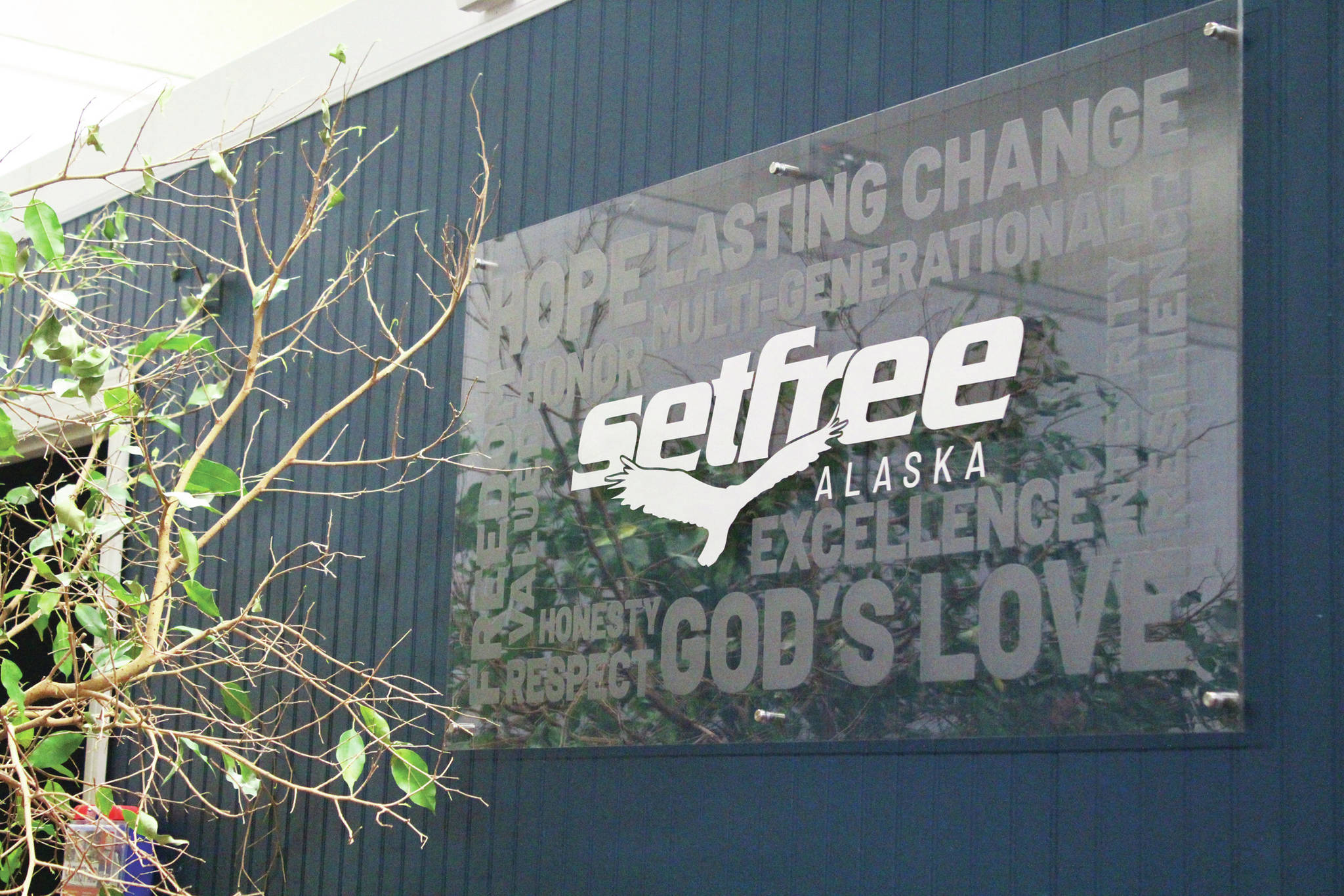 A sign for Set Free Alaska hangs in the faith-based addiction treatment nonprofit’s new outpatient servies location on Ocean Drive on Monday, Jan. 16, 2020 in Homer, Alaska. The organization held an open house to celebrate the outpatient services building opening. (Photo by Megan Pacer/Homer News)