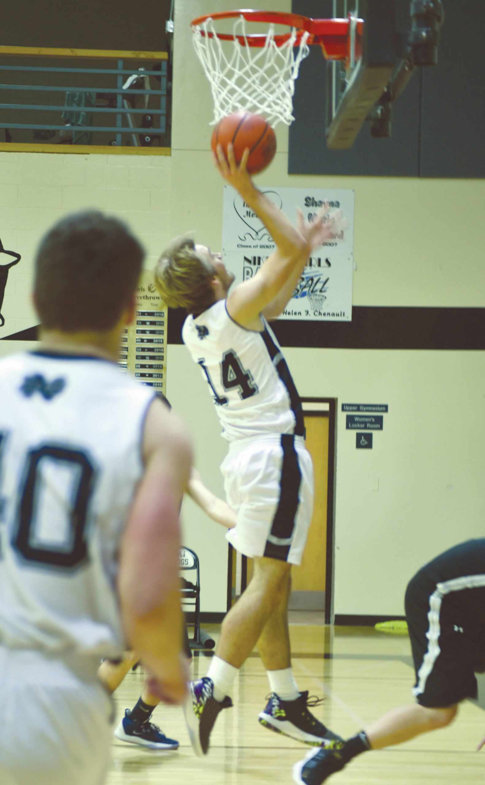 Nikiski’s Michael Eiter goes up for a layup Friday, Jan. 17, 2020, at the Russ Hitchcock Tip Off Tournament in Nikiski, Alaska. (Photo by Elizabeth Earl/For the Clarion)