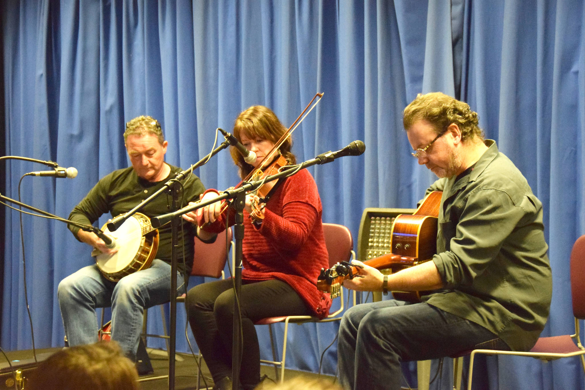 From left, musicians John Walsh, Rose Flanagan and Pat Broaders perform at the annual Winter Concert of Traditional Irish Music at Kenai Peninsula College in Kenai, Alaska on Feb. 1, 2019. (Photo by Brian Mazurek/Peninsula Clarion)
