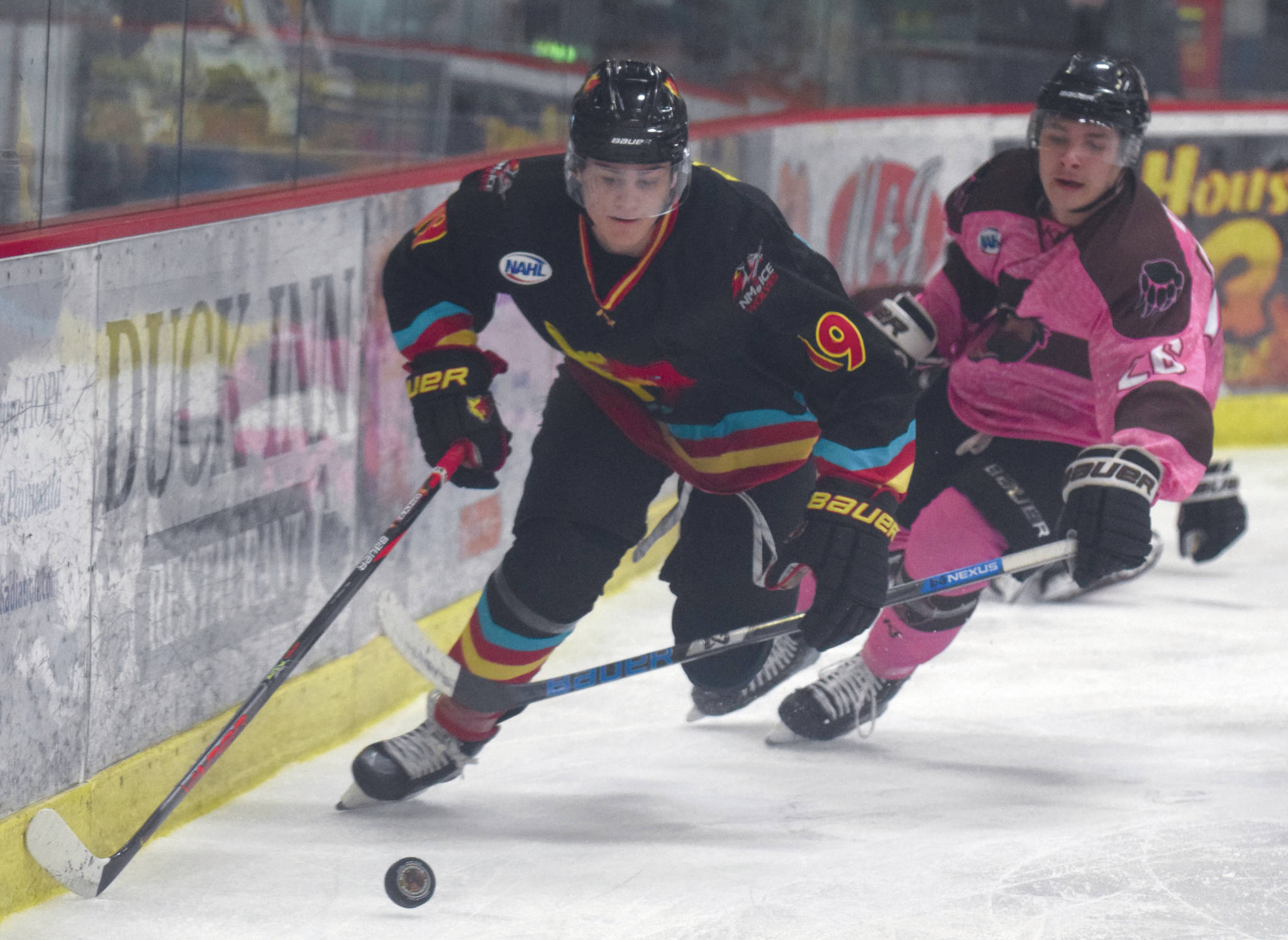 New Mexico Ice Wolves forward Tristan Rand shields the puck from Kenai River Brown Bears forward Daymin Dodge on Friday, Jan. 24, 2020, at the Soldotna Regional Sports Complex in Soldotna, Alaska. (Photo by Jeff Helminiak/Peninsula Clarion)