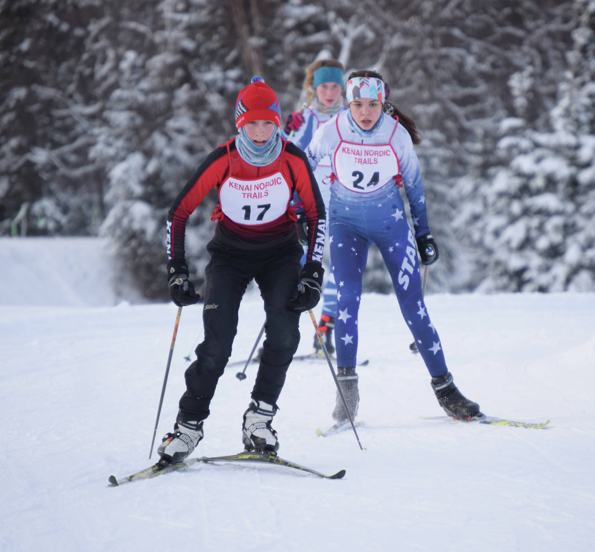 Kenai Central’s Jayna Boonstra leads Soldotna’s Erika Arthur and Palmer’s Zoe Copp on Friday, Jan. 24, 2020, at the Kenai Klassic at the Kenai Golf Course in Kenai, Alaska. (Photo by Jeff Helminiak/Peninsula Clarion)