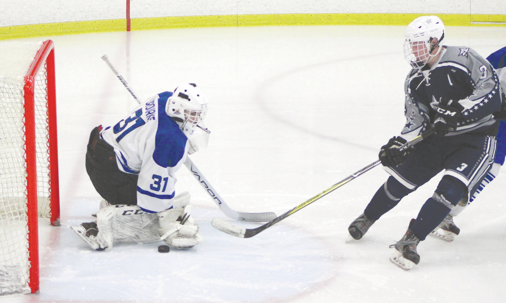 Palmer goalie TJ O’Rourke makes a save on a Galen Brantley III shot during a 2-0 loss to the Stars on Friday at the MTA Events Center in Palmer. (Photo by Tim Rockey/Frontiersman)