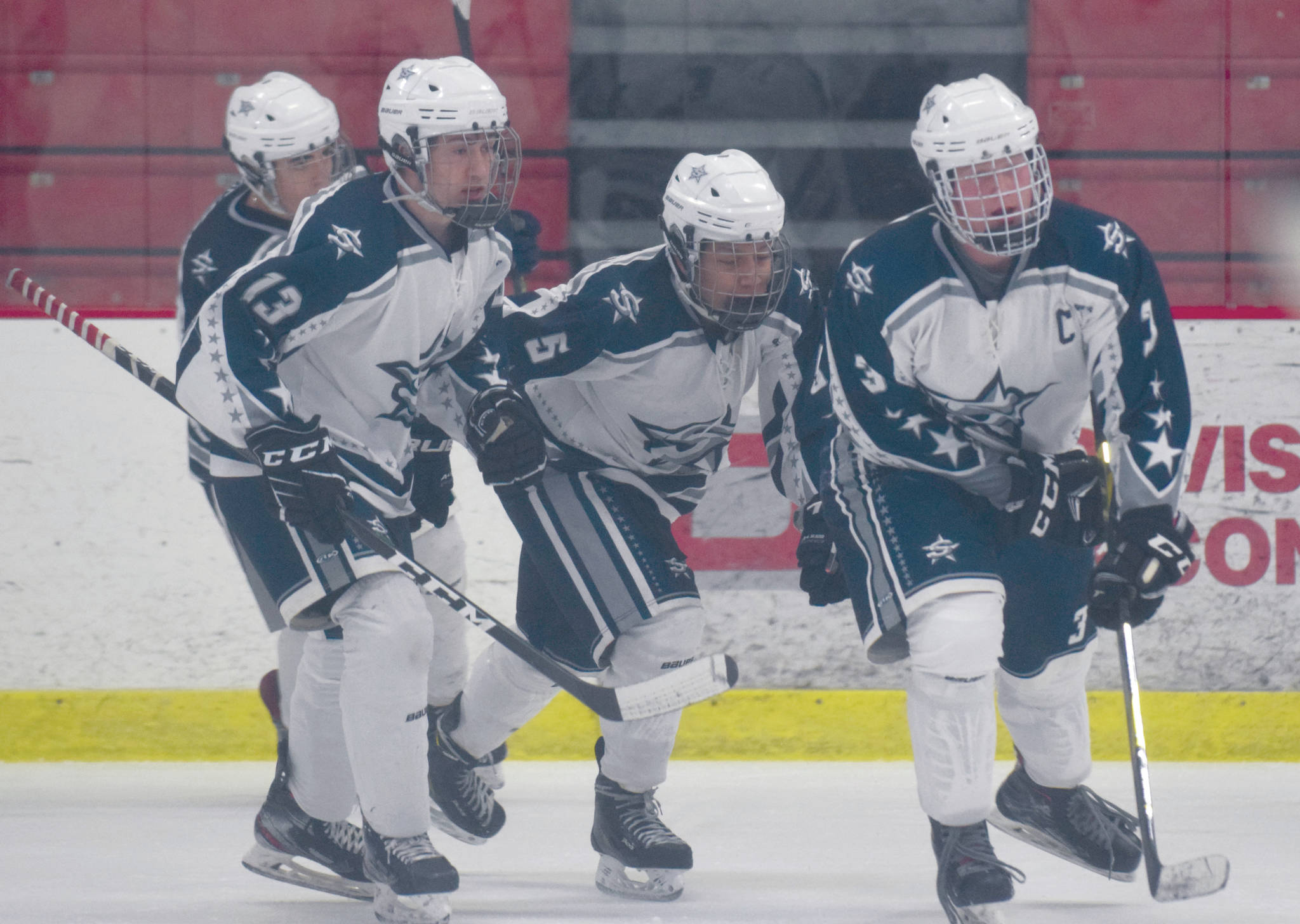 Soldotna’s Galen Brantley III leads his team to the bench Tuesday, Jan. 28, 2020, after scoring a first-period goal against Kenai Central at the Soldotna Regional Sports Complex in Soldotna, Alaska. (Photo by Jeff Helminiak/Peninsula Clarion)