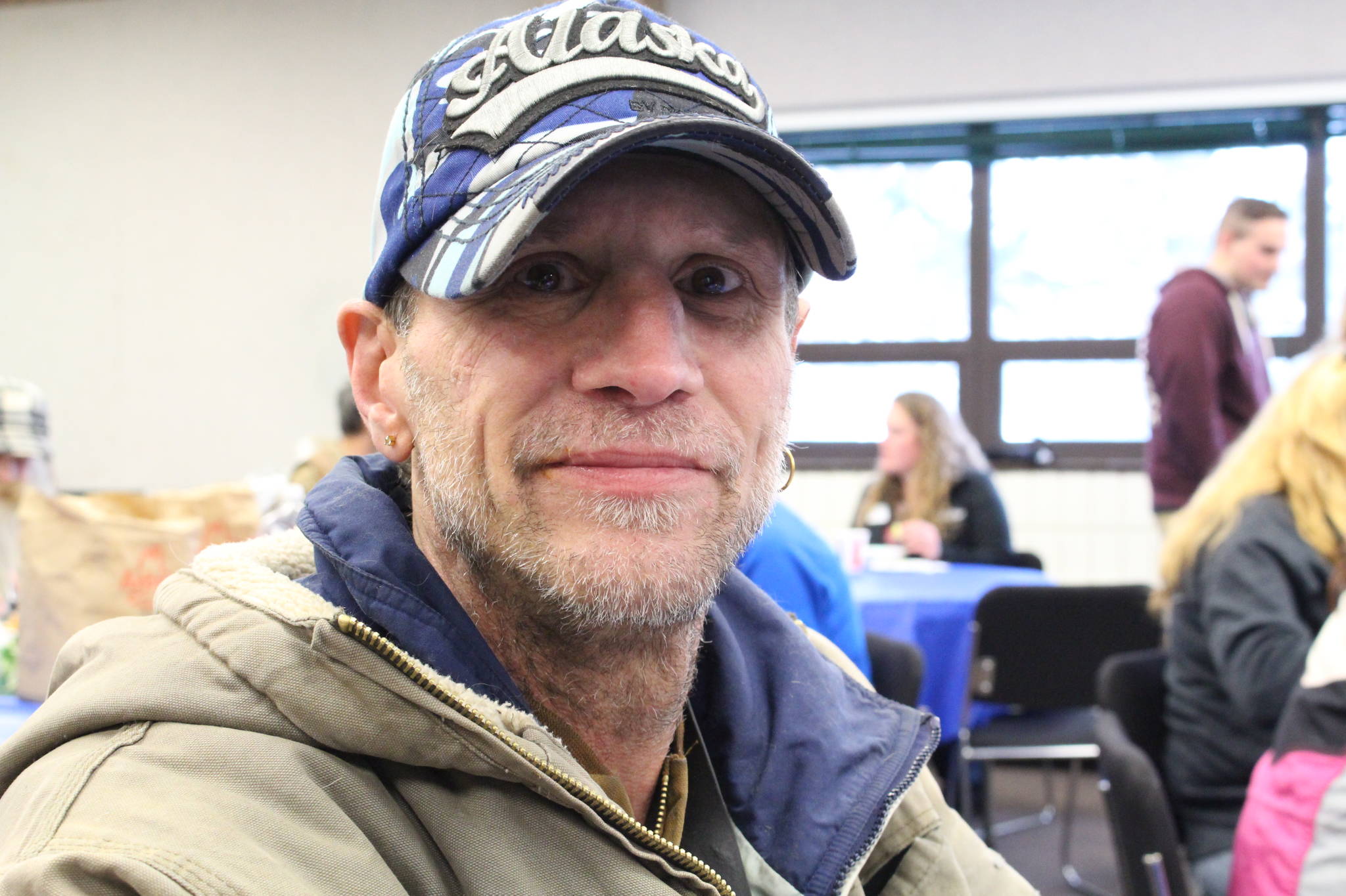 Scott Morris smiles during the 2020 Project Homeless Connect event at the Soldotna Regional Sports Complex in Soldotna, Alaska, on Jan. 29, 2020. (Photo by Brian Mazurek/Peninsula Clarion)