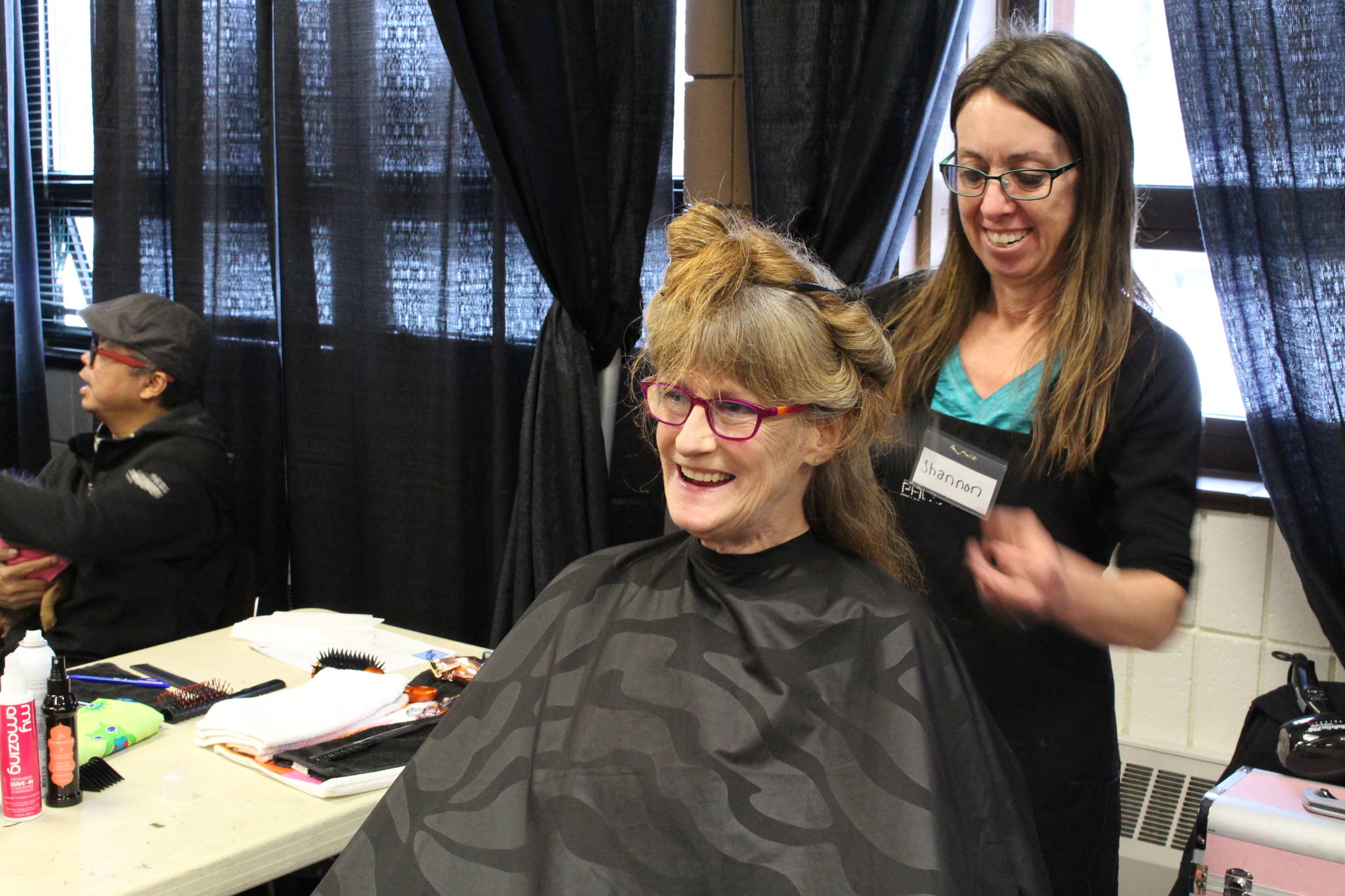 Junetta Delong gets her hair cut during the 2020 Project Homeless Connect event at the Soldotna Regional Sports Complex in Soldotna, Alaska, on Jan. 29, 2020. (Photo by Brian Mazurek/Peninsula Clarion)