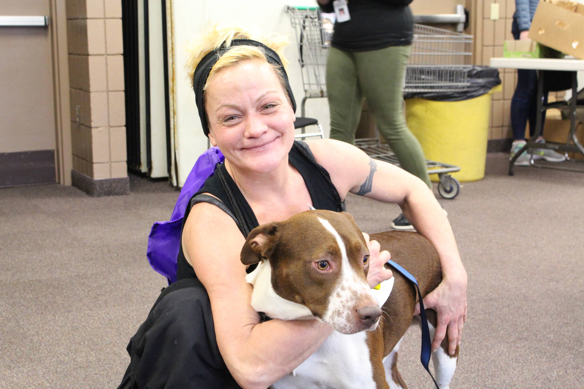 Danielle Bauman and her dog Dozer attend the 2020 Project Homeless Connect event at the Soldotna Regional Sports Complex in Soldotna, Alaska, on Jan. 29, 2020. (Photo by Brian Mazurek/Peninsula Clarion)