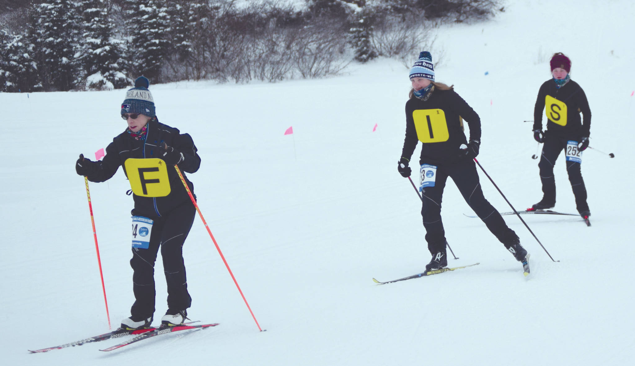 Patty Moran leads Madison McDonald and Audrey McDonald at the Ski for Women on Sunday, Feb. 2, 2020, at Tsalteshi Trails just outside of Soldotna, Alaska. The three wore tiles for a group costume inspired by the app Words With Friends. (Photo by Jeff Helminiak/Peninsula Clarion)