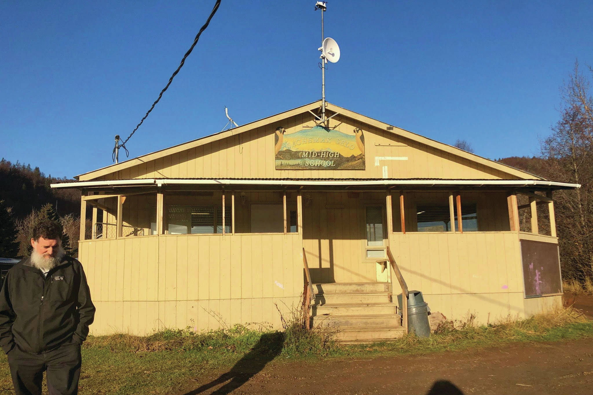 Principal Michael Wojack stands in front of one of the buildings used as the Kachemak Selo School, Nov. 12, 2019, in Kachemak Selo, Alaska. (Photo by Victoria Petersen/Peninsula Clarion)