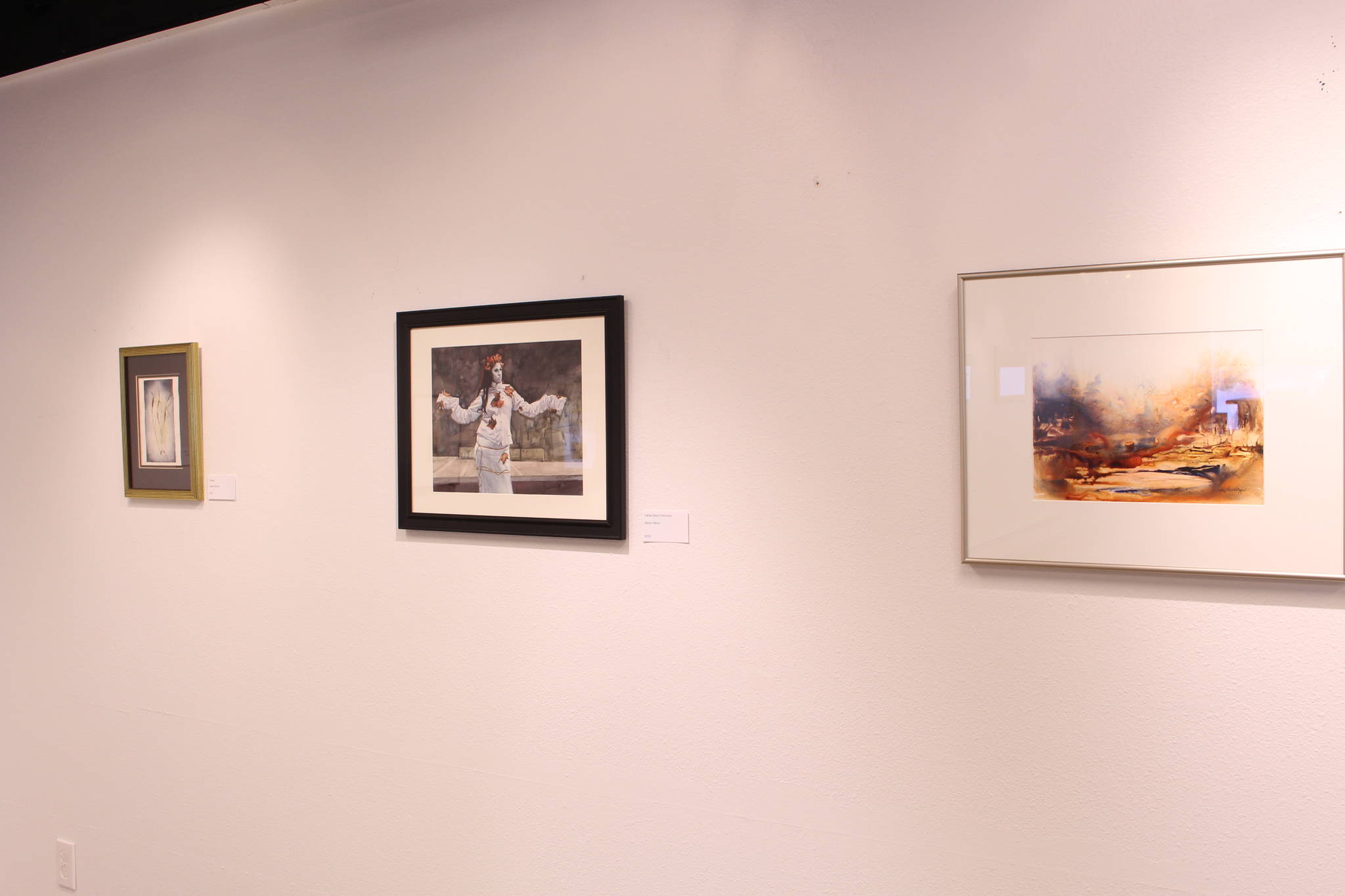 Watercolor paintings by Janie Stewart, James Adcox and Melinda Hershberger are seen on display at the Kenai Fine Art Center in Kenai, Alaska on Feb. 4, 2020. (Photo by Brian Mazurek/Peninsula Clarion)