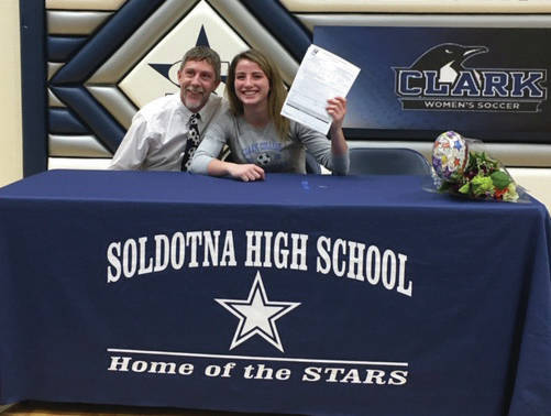 SoHi senior Ryann Cannava, with head coach Jimmy Love, signed to play soccer at Clark Community College on Wednesday, Feb. 5, 2020, at Soldotna High School in Soldotna, Alaska. (Photo by Jeff Helminiak/Peninsula Clarion)