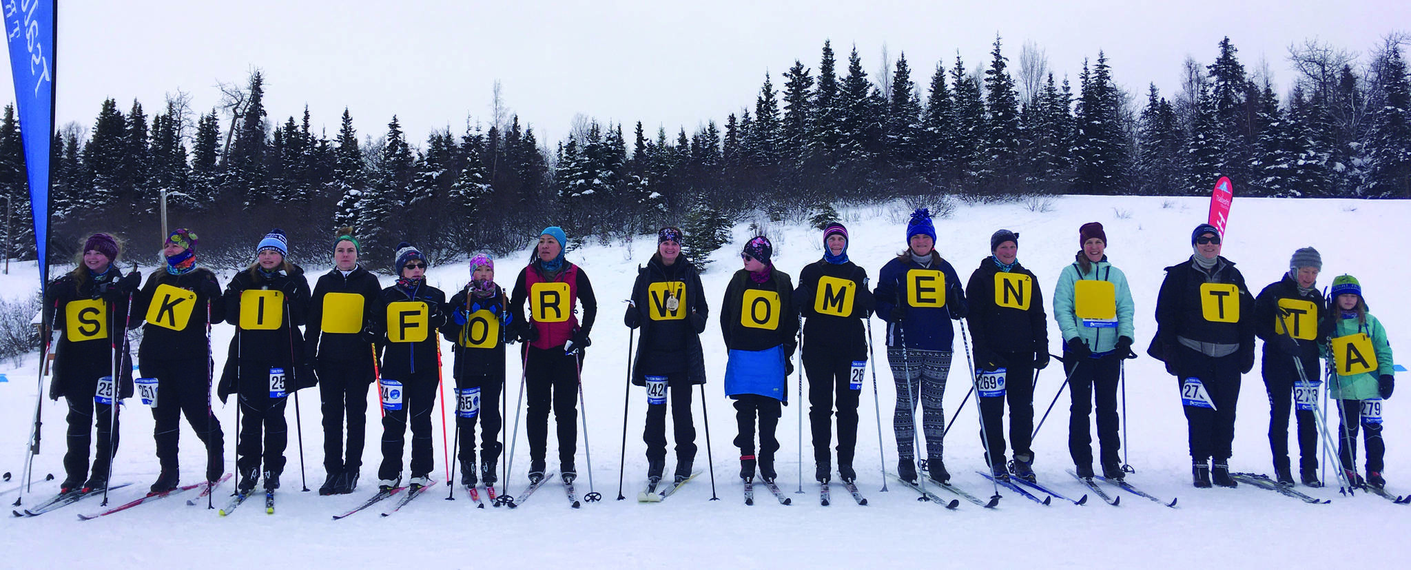 Ski for Women participants show off their group costume inspired by the app Words With Friends on Sunday, Feb. 2, 2020, at Tsalteshi Trails near Soldotna, Alaska. (Photo by Jeff Helminiak/Peninsula Clarion)