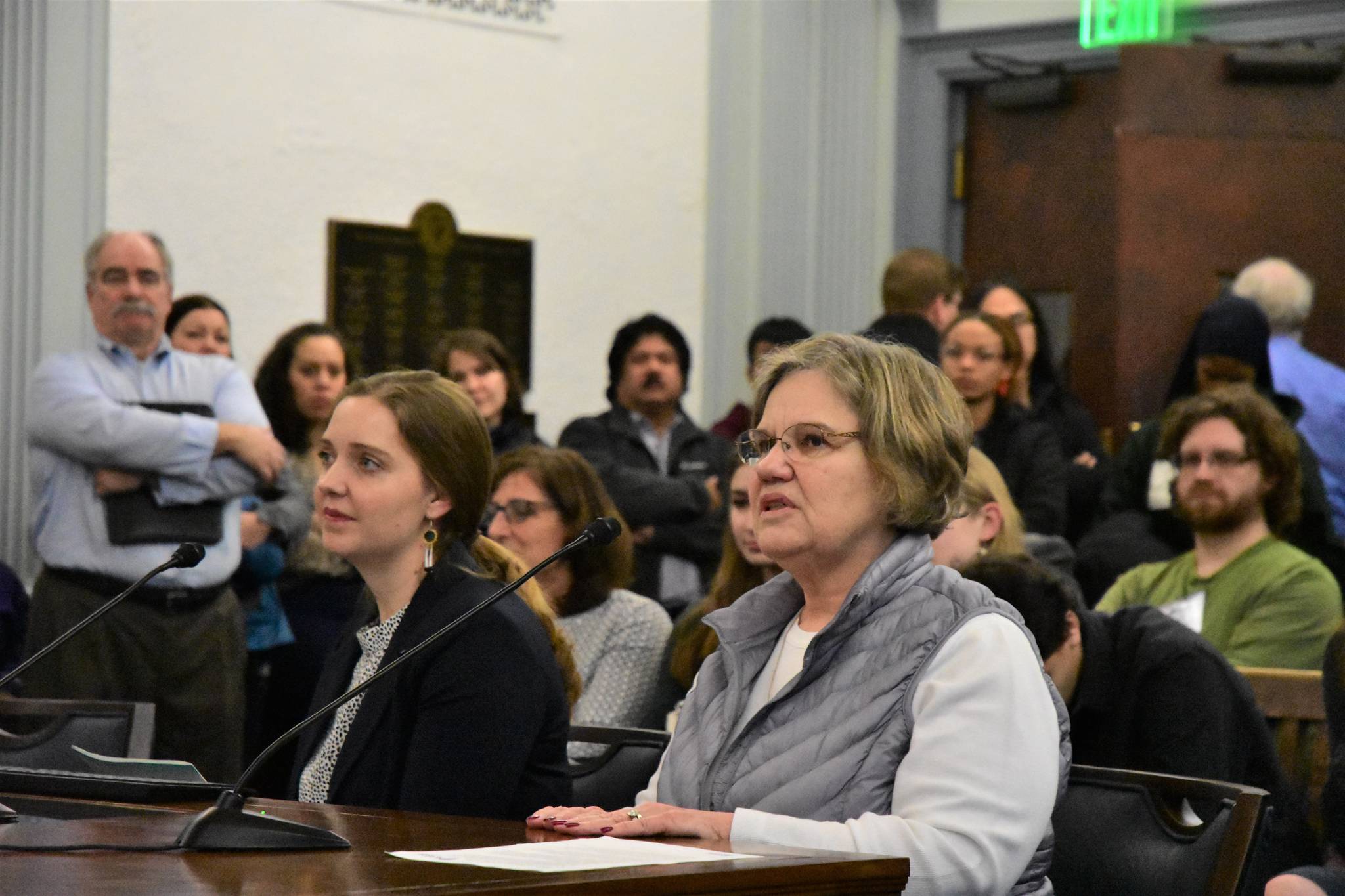 Katie Oliver, left, and Judy Carstens of the Kodiack Island Borough School District Board of Education give testimony to the Senate Education Committee at the Alaska State Capitol on Monday. (Peter Segall | Juneau Empire)
