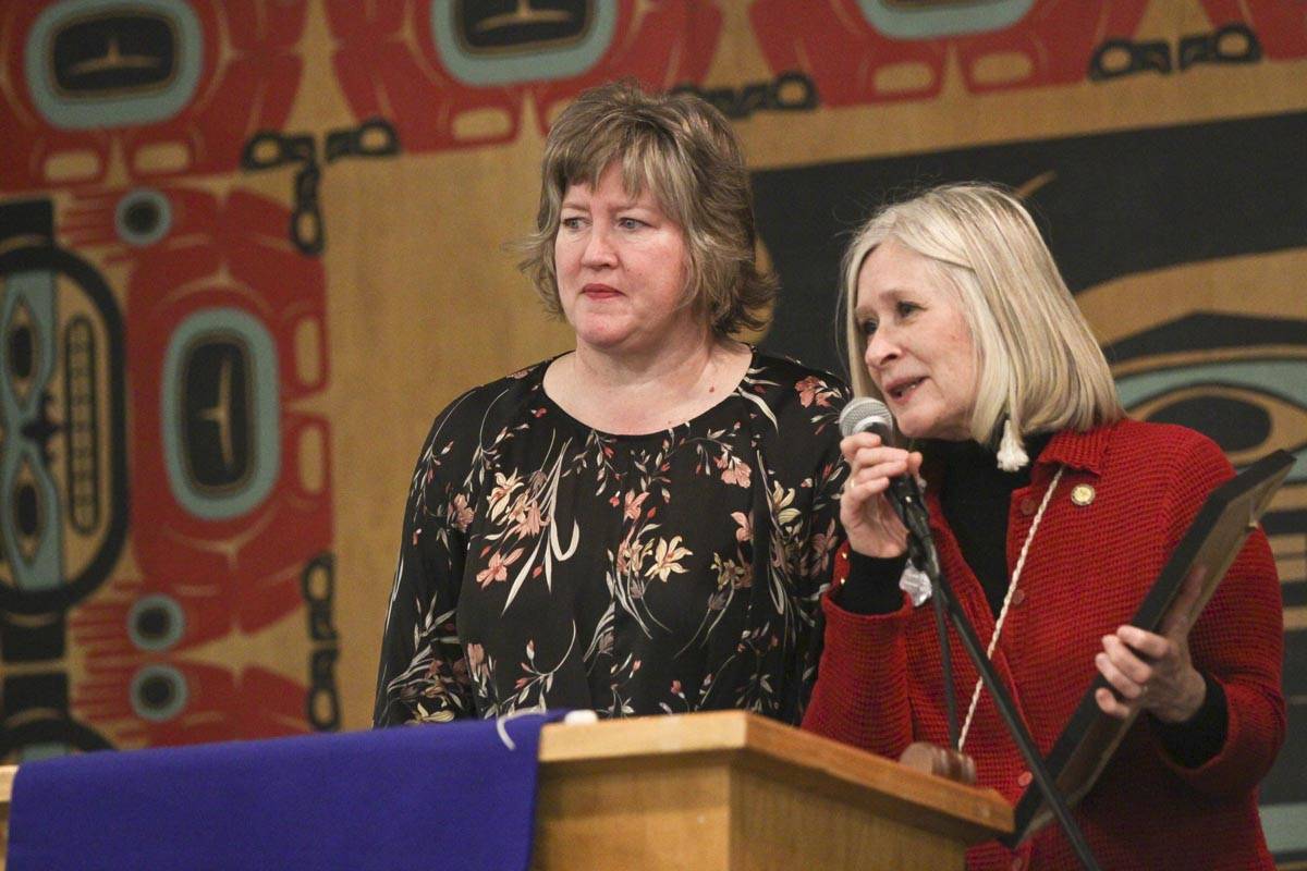 Rep. Sara Hannan and Rep. Andi Story address the crowd during the Elizabeth Peratrovich Day celebration at the Tlingit and Haida Community Council Sunday. (Michael S. Lockett | Juneau Empire)