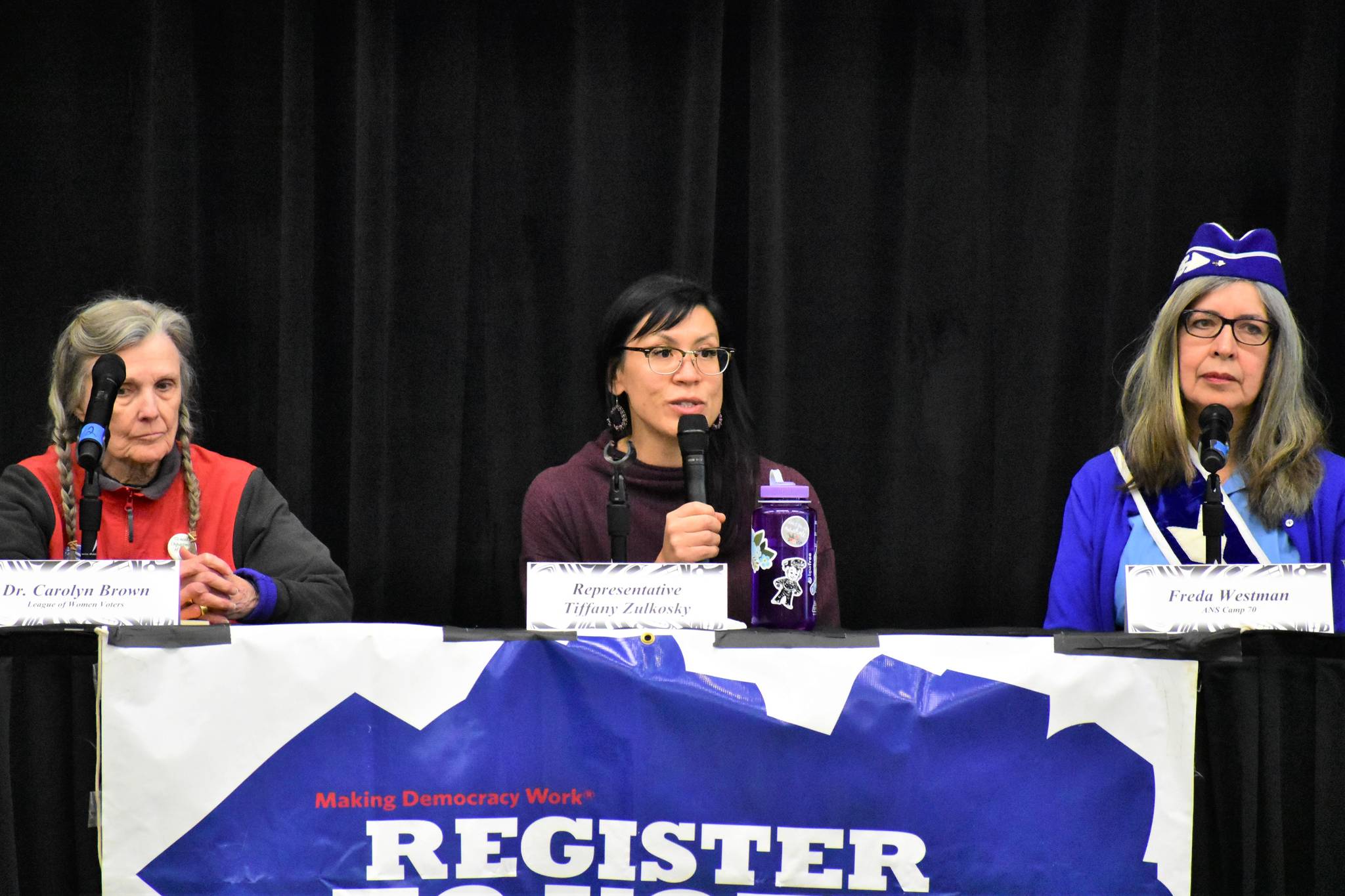 Rep. Tiffany Zulkosky, D-Bethel, center, speaks at the Native Issues Forum at Elizabeth Peratrovich Hall with Dr. carolyn Brown, left, and Freda Westman, right, on Monday.                                Peter Segall | Juneau Empire