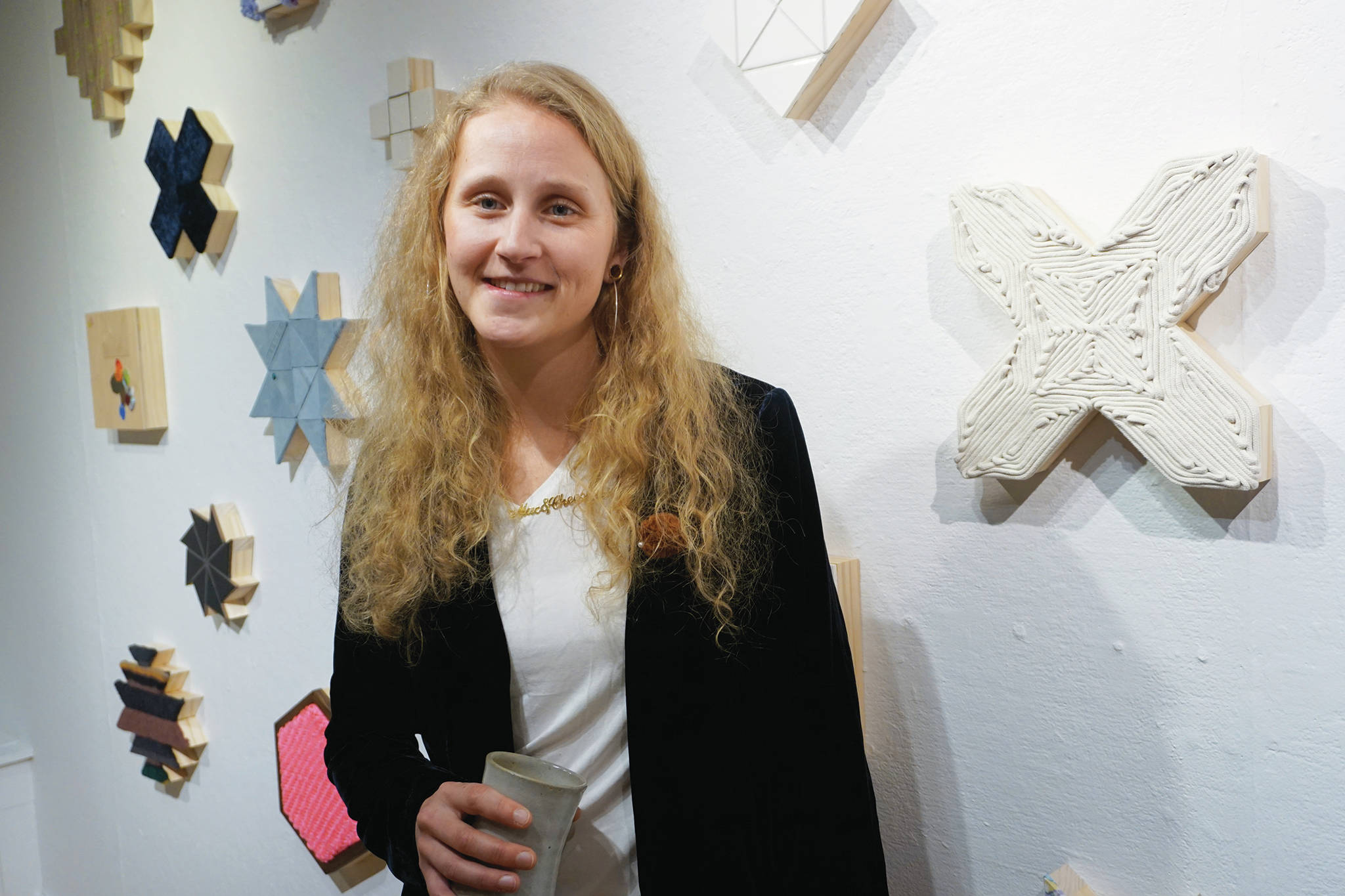 Tamara Wilson poses for a photo at at the First Friday opening of her show, “Macaroni and Cheese.”