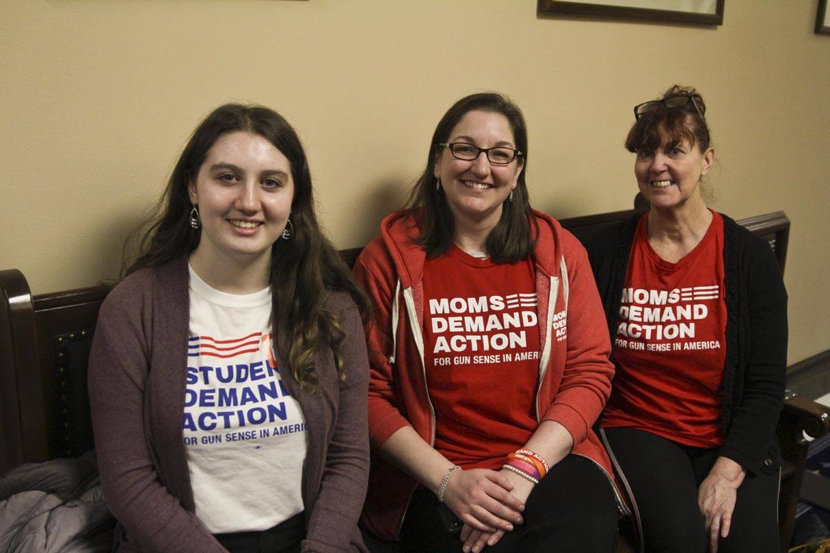 Michael S. Lockett | Juneau Empire                                Portia Carney, Justina Sullivan, and Pearl Temple pose in the Capitol before soliciting lawmakers for their support of House Bill 62, or the ability to temporarily take guns away from people who have made threats or are having a mental health crisis.