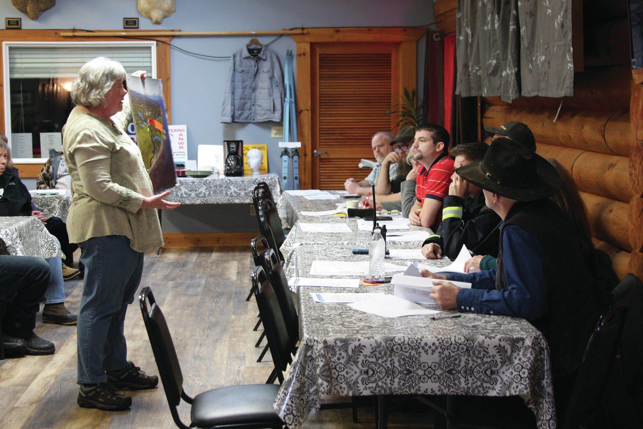 Teresa Jacobson Gregory presents a visual illustration of the proposed gravel pit extension and the impacts it may have on residents and the surrounding state recreation area at the Anchor Point Advisory Planning Commission Meeting on Thursday, Feb. 13, 2020, at the Anchor Point Senior Center in Anchor Point, Alaska. (Photo by Delcenia Cosman)