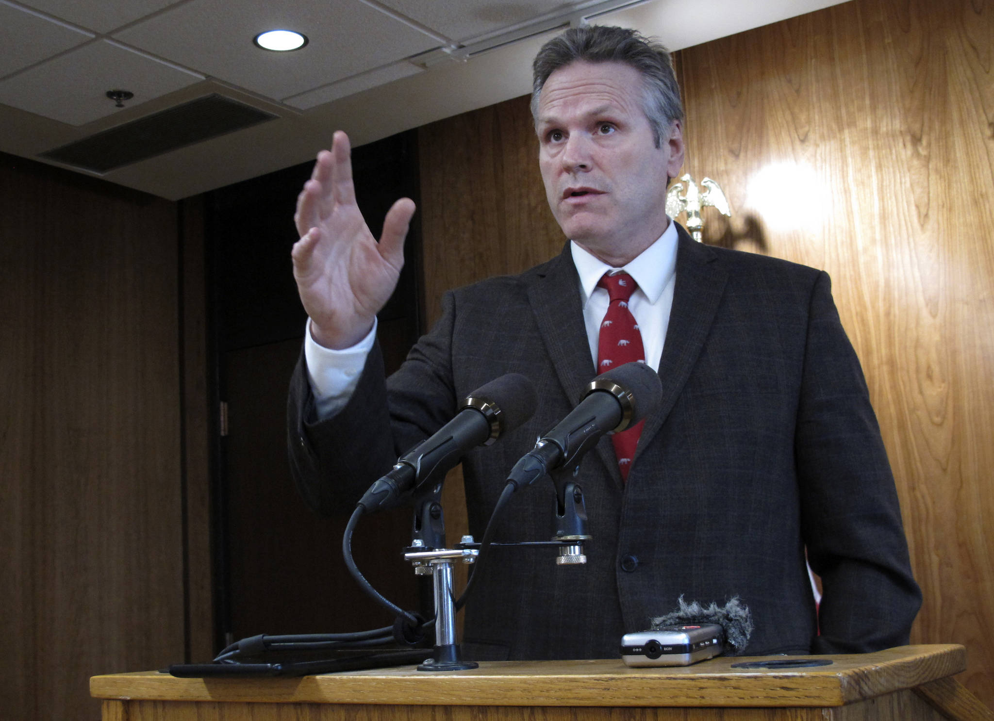Alaska Gov. Mike Dunleavy speaks to reporters on Wednesday, Feb. 19, 2020, in Juneau, Alaska. Dunleavy has proposed giving Alaskans an additional roughly $1,300 from the state’s oil wealth fund on top of the roughly $1,600 they received last fall that he says in keeping with a formula in state law. The formula has not been followed in recent years amid a budget deficit. (AP Photo/Becky Bohrer)