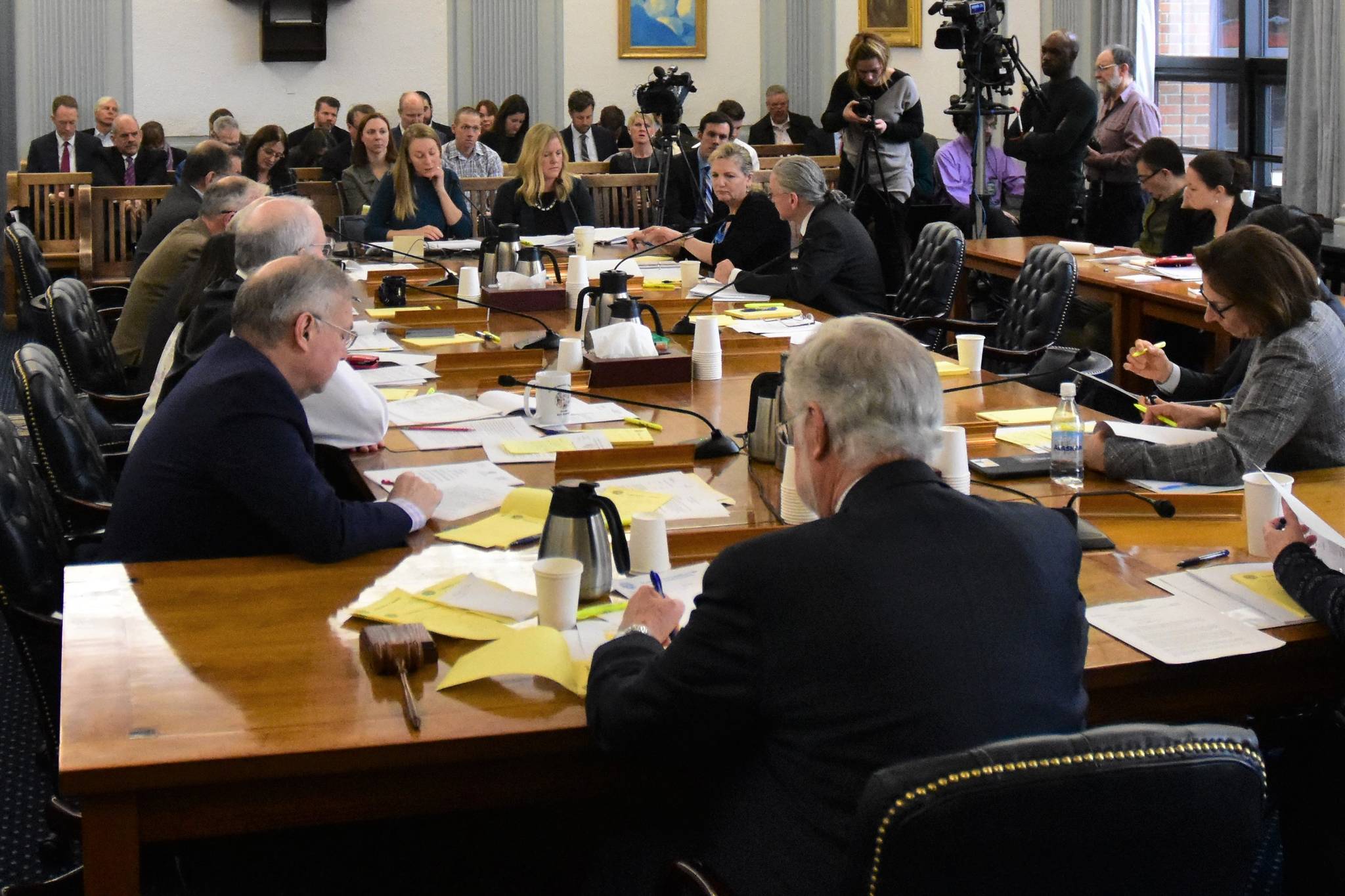 Lawmakers on the Legislative Council asks questions of Megan Wallace, Legal Services director and deputy director Emily Nauman of the Legislative Affairs Agency at a meeting on Tuesday, Feb. 25, 2020. (Peter Segall | Juneau Empire)