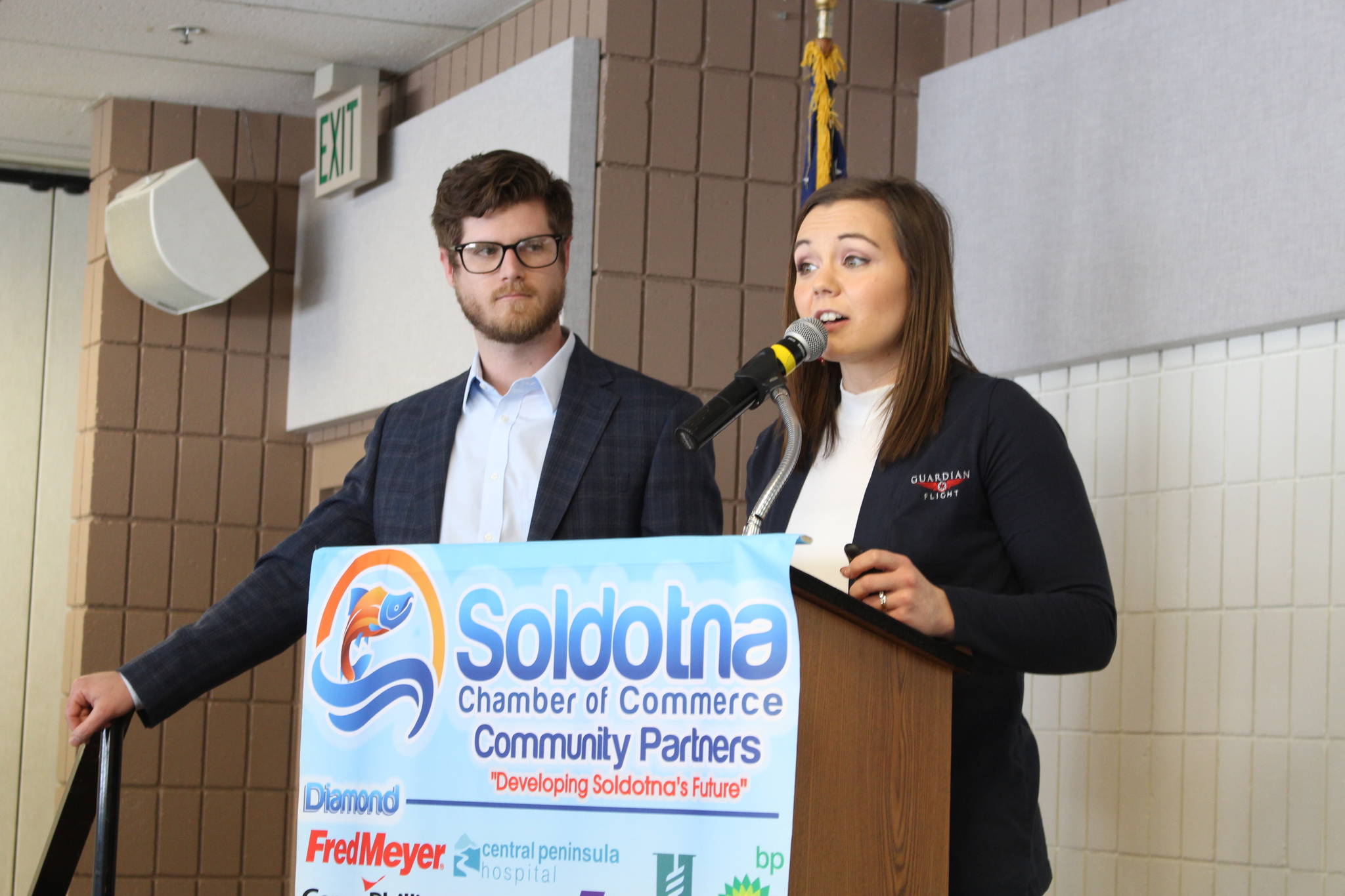 Brian Mazurek / Peninsula Clarion                                Riley Little and Jessica Hyatt give a presentation on Guardian Flight Alaska to the Soldotna Chamber of Commerce at the Soldotna Sports Complex in Soldotna on Wednesday. Little is the membership sales manager and Hyatt is the business development specialist for Guardian Flight Alaska.