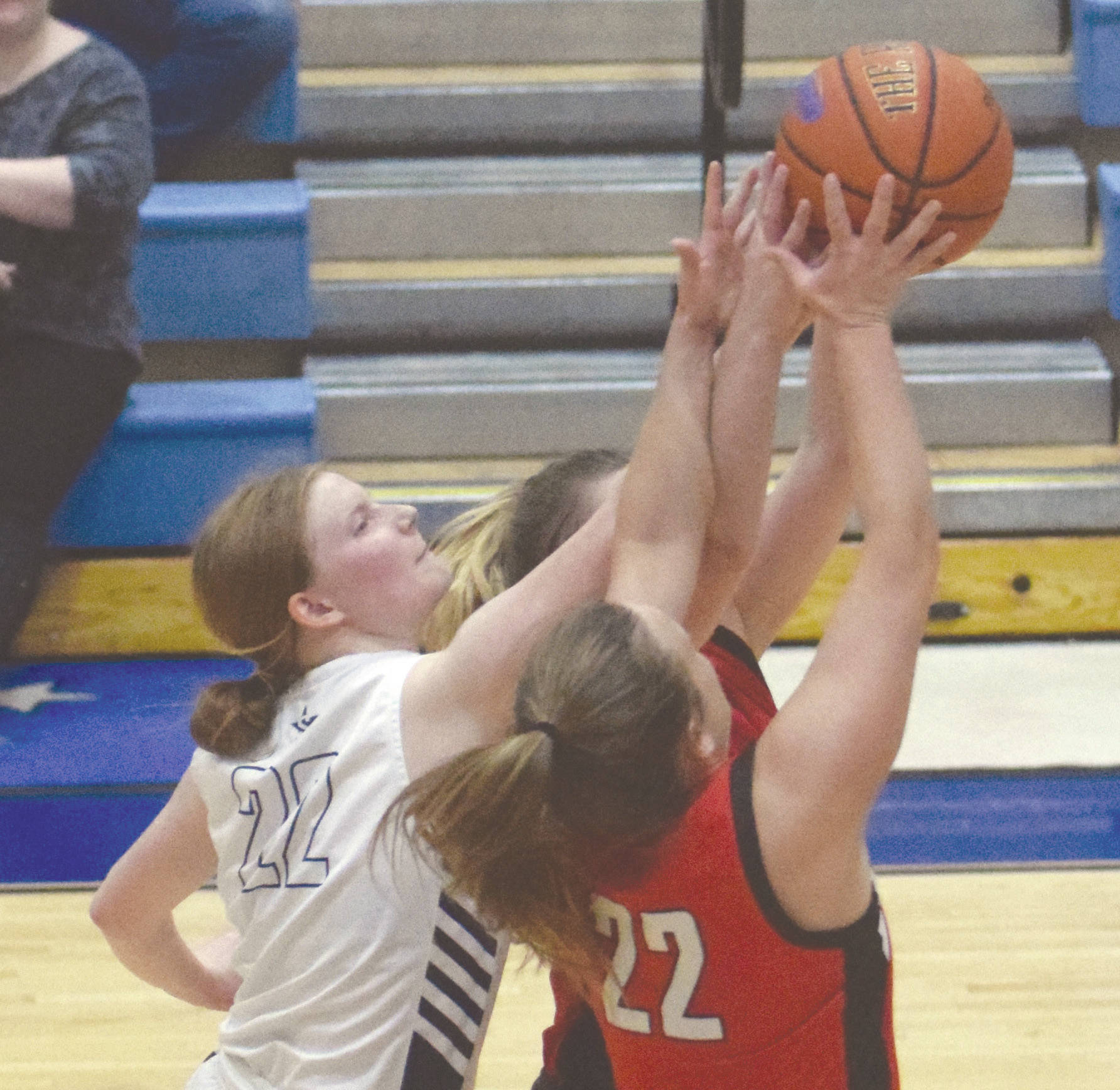 Soldotna’s Kianna Holland battles with Kenai’s Jaiden Streiff for the rebound Saturday, Feb. 29, 2020, at Soldotna High School in Soldotna, Alaska. (Photo by Jeff Helminiak/Peninsula Clarion)