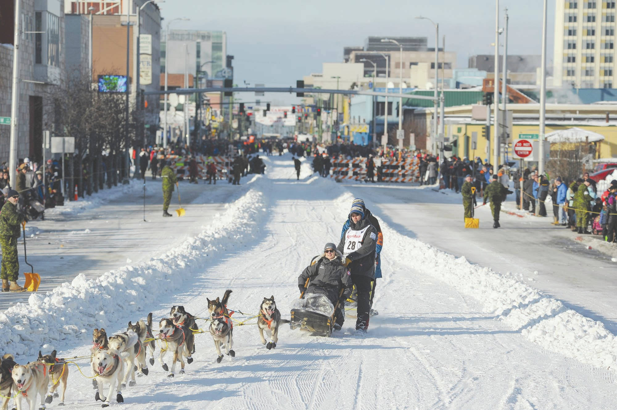 In this March 2, 2019, file photo, defending champion Joar Lefseth Ulsom runs his team down Fourth Ave during the ceremonial start of the Iditarod Trail Sled Dog Race in Anchorage, Alaska. Alaska Airlines announced Monday, March 2, 2020, it will drop its sponsorship of the Iditarod, Alaska’s most famous sporting event. The airline in a statement said the decision was made as it transitions to a new corporate giving strategy, but People for the Ethical Treatment of Animals, the most vocal critic of the thousand-mile sled dog race across Alaska, immediately took credit. (AP Photo/Michael Dinneen, File)