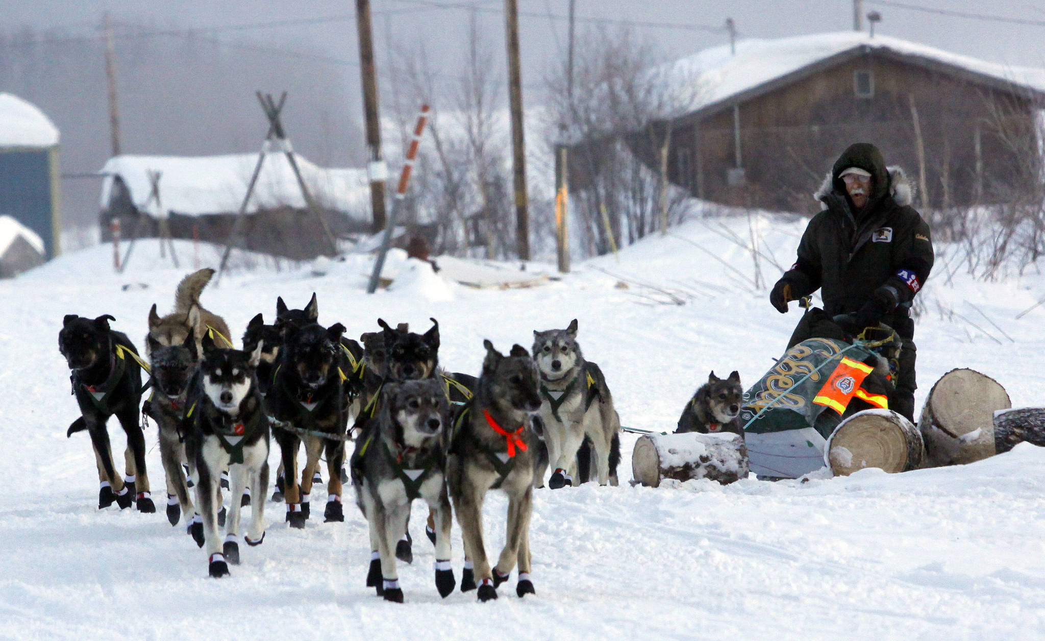 In this March 15, 2009, Jeff King leaves the Kaltag, Alaska, checkpoint on the Iditarod Trail Sled Dog Race. Emergency surgery has sidelined the four-time race winner days before he was set to compete in his 30th race. King withdrew Tuesday, March 3, 2020, over concerns for his health, a spokeswoman for the Iditarod told The Associated Press. The race will start Sunday north of Anchorage. (AP Photo/Al Grillo,File)