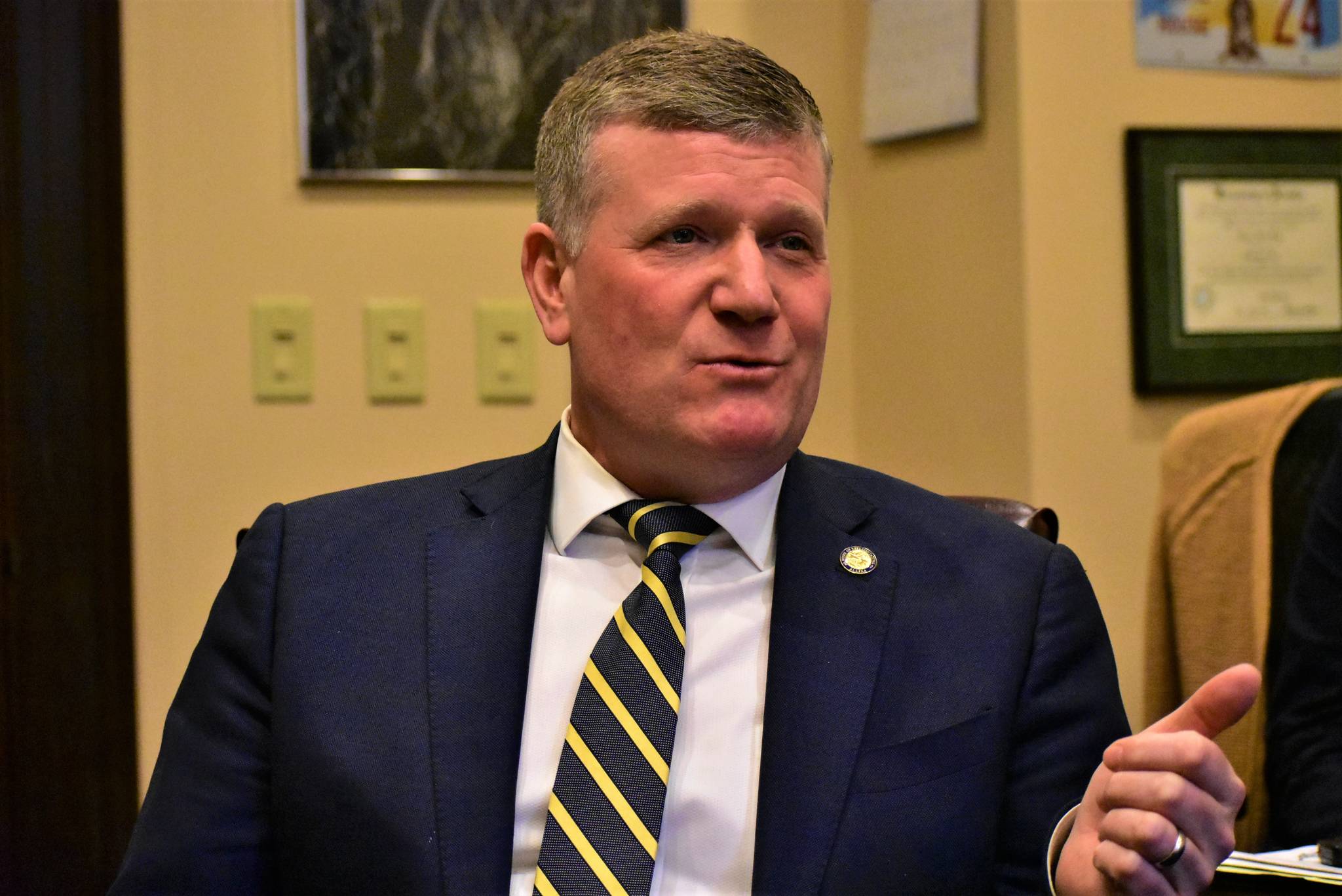 Rep. Chuck Kopp, R-Anchorage, speaks with reporters in his office at the Capitol on Wednesday.