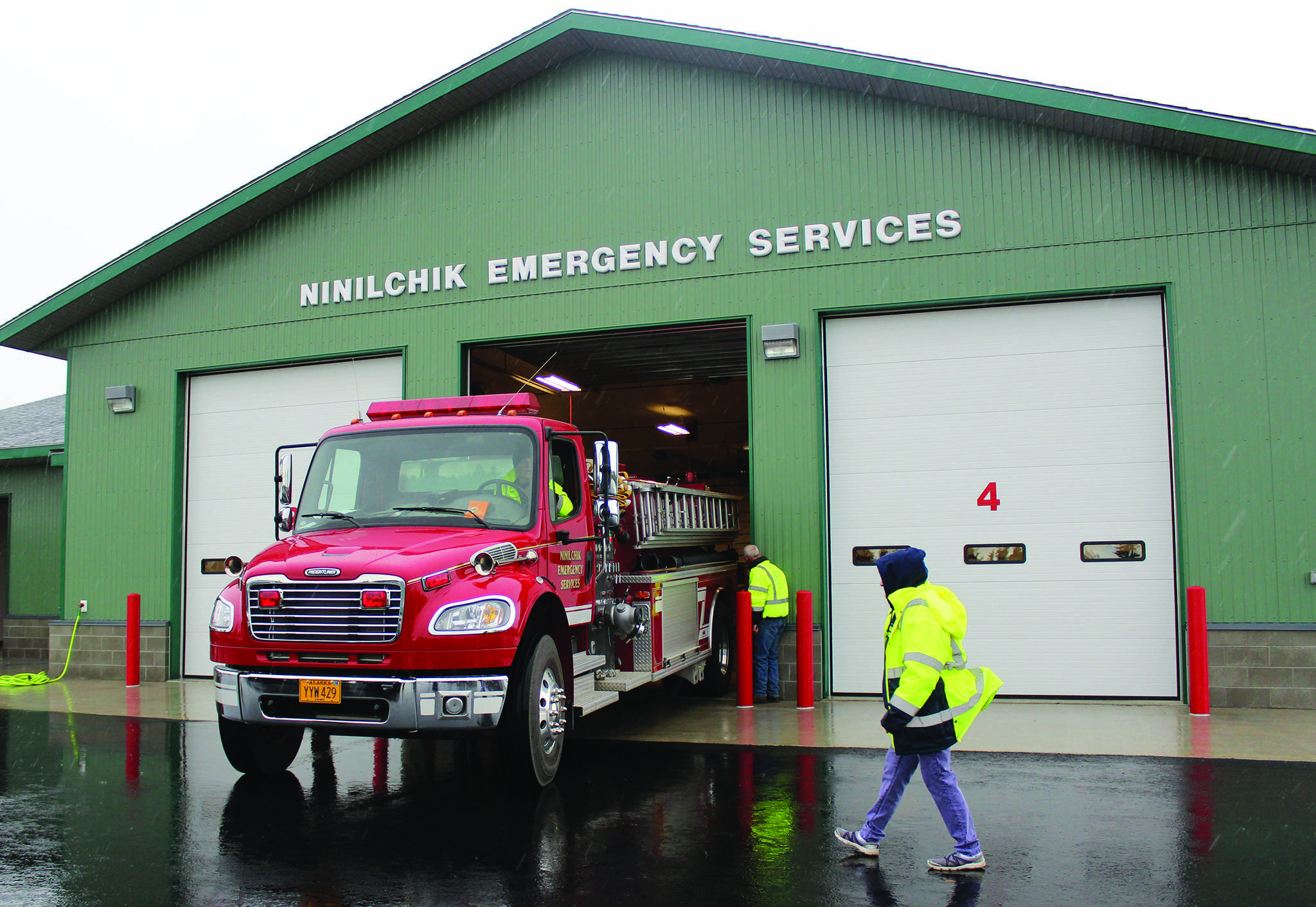 Ninilchik Fire Chief David Bear moves the fire truck out of the new Ninilchik Emergency Services building on Aug. 9, 2014, to make room for visitors to the open house of the new NES building. (Homer News file photo)