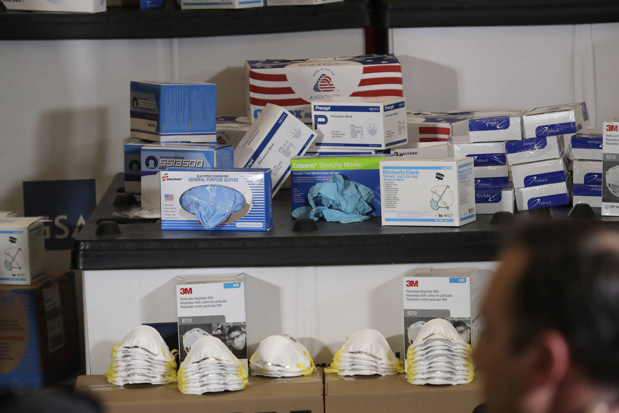 Masks, gloves, and other protective supplies are displayed during a visit of Vice President Mike Pence, Thursday, March 5, 2020 to Camp Murray in Washington state. Pence was in Washington to discuss the state’s efforts to fight the spread of the COVID-19 coronavirus. (AP Photo/Ted S. Warren)