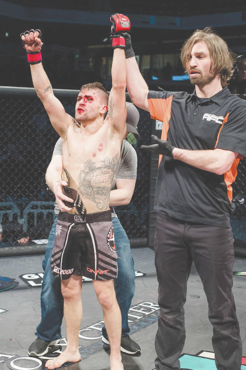 Victor Martinez is awarded the Alaska Fighting Championship bantamweight title on Feb. 26 at the Alaska Airlines Center in Anchorage, Alaska. (Photo courtesy of Maria Bundy)