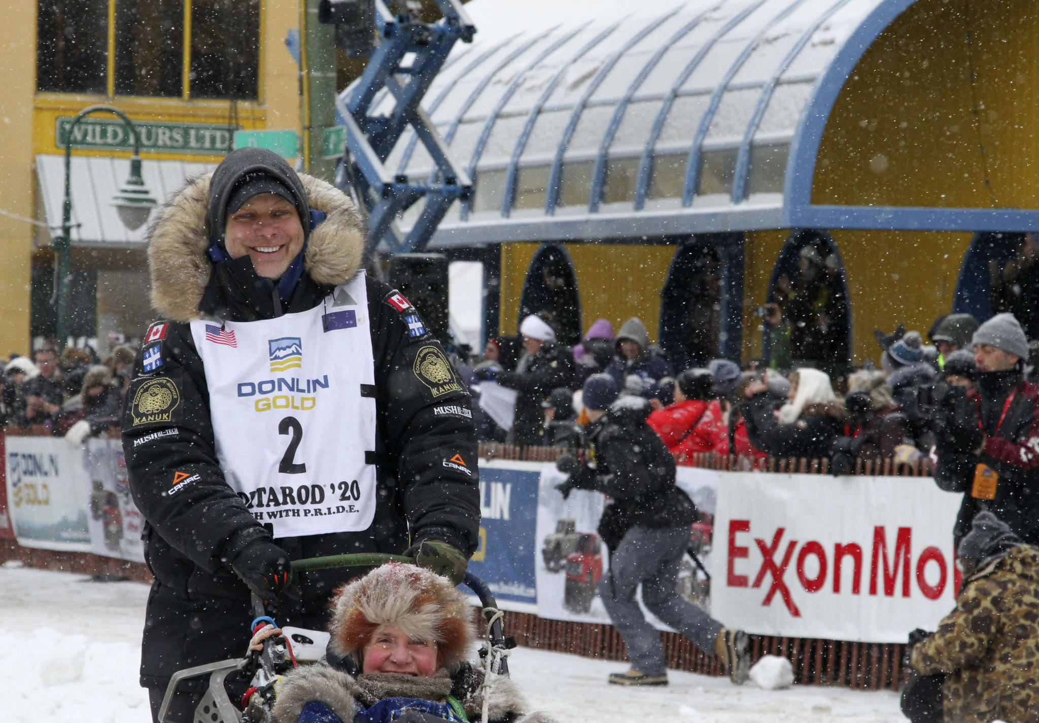 Musher Martin Massicotte of St-Tite, Quebec, Canada, leaves the start line during the ceremonial start of the Iditarod Trail Sled Dog Race Saturday, March 7, 2020, in Anchorage, Alaska. The real race starts March 8 about 50 miles north of Anchorage, with the winner expected in the Bering Sea coastal town of Nome about 10 or 11 days later. (AP Photo/Mark Thiessen)
